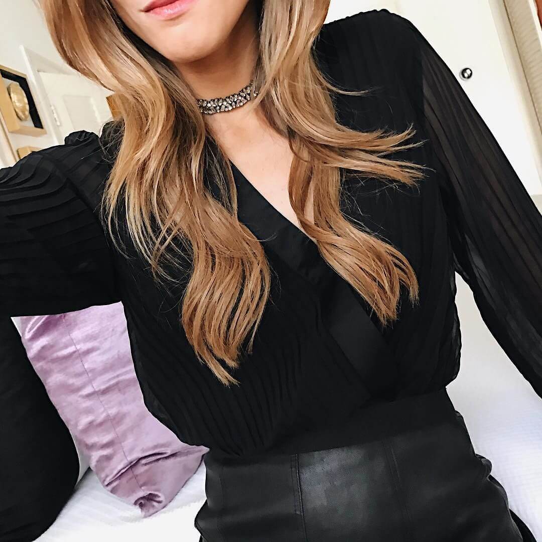 black pleated top with leather skirt and crystal choker 