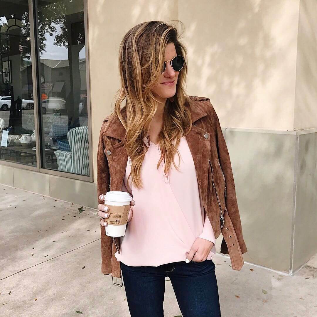 brighton the day pink sweater, tan moto jacket, jeans