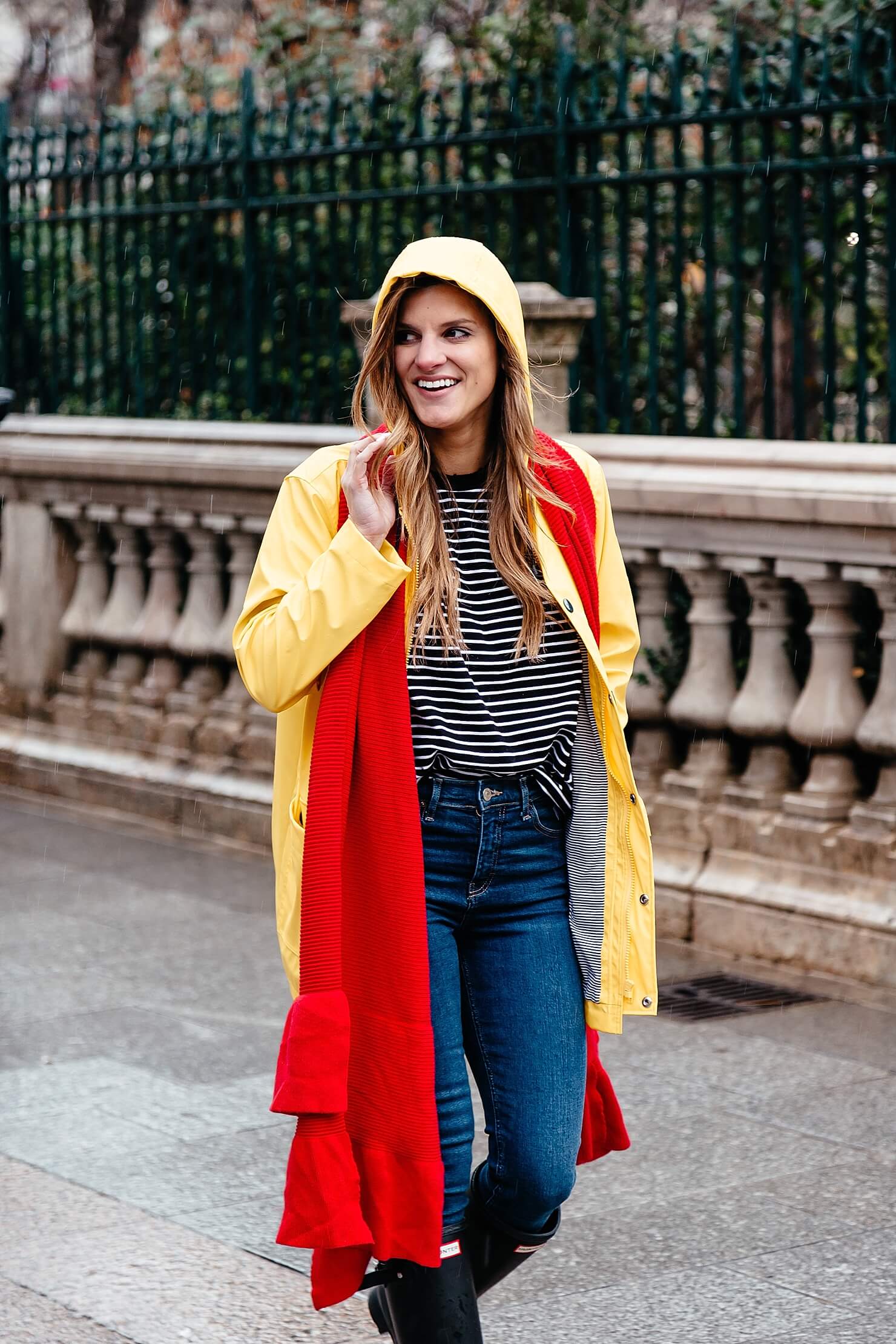 hunter boots, jeans, black and white striped tee, yellow rain jacket, red scarf, rainy day outfit