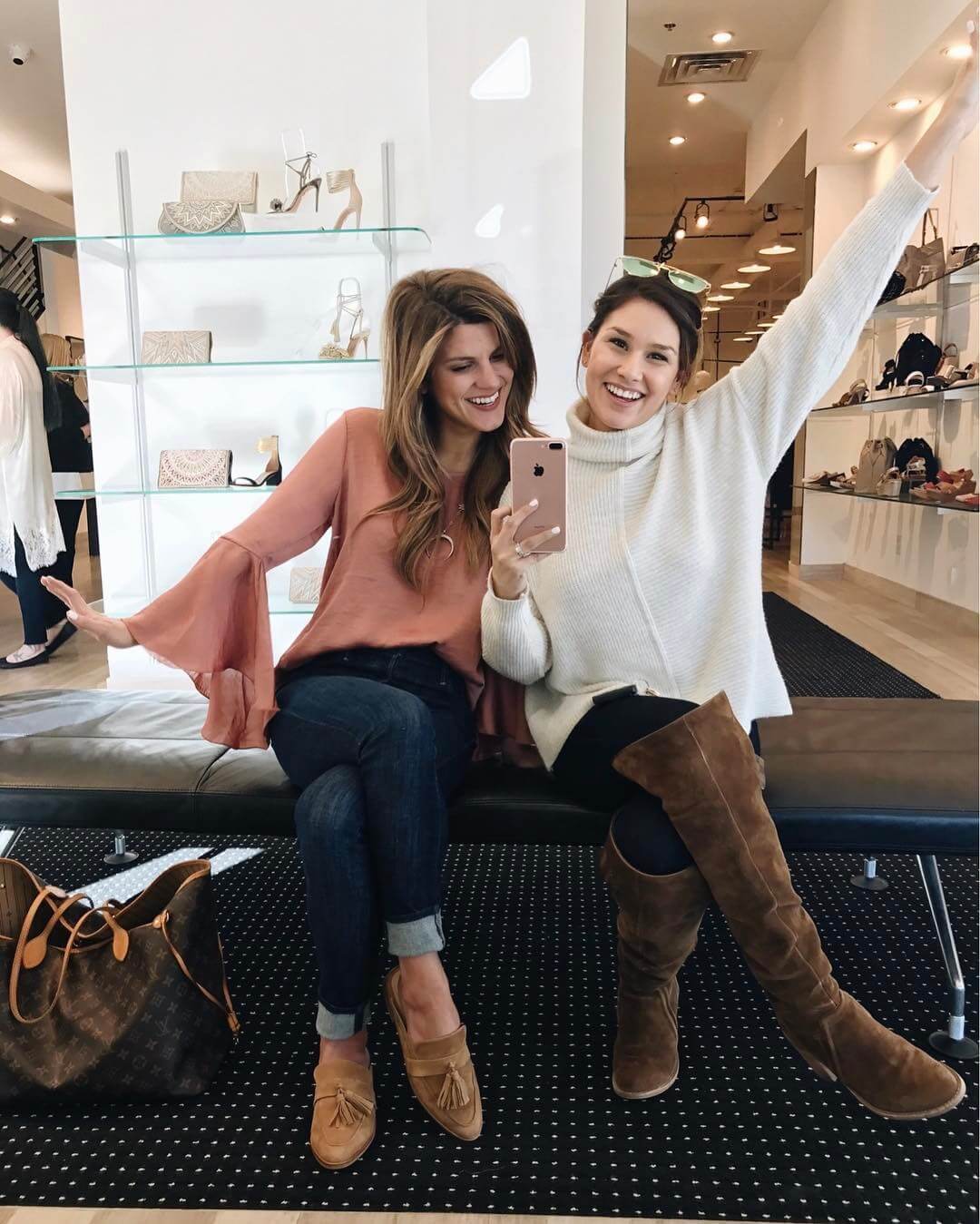 Brighton and Lisel shopping wearing flare top with jeans and tan mules