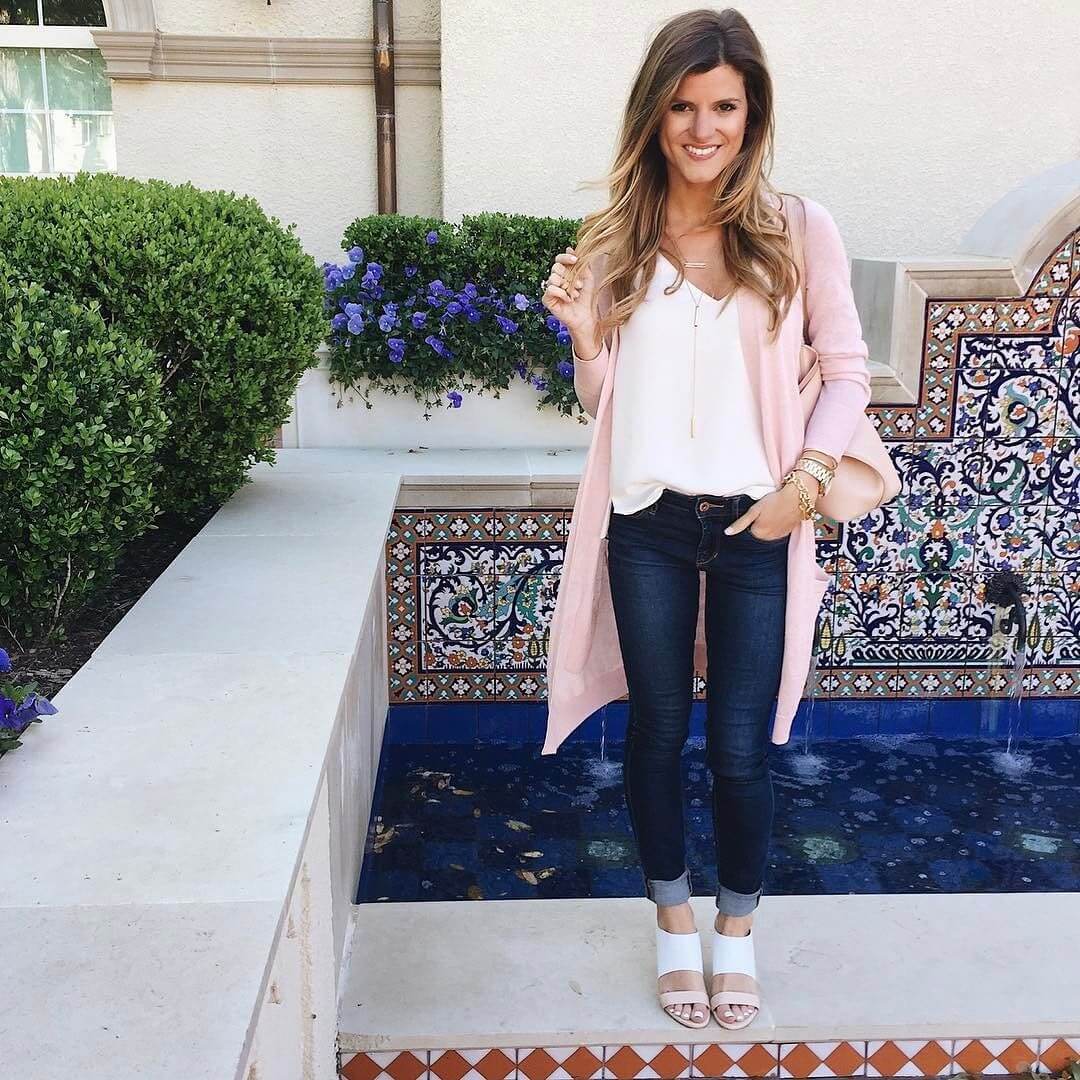 pink light weight cardigan and white tank top and jeans