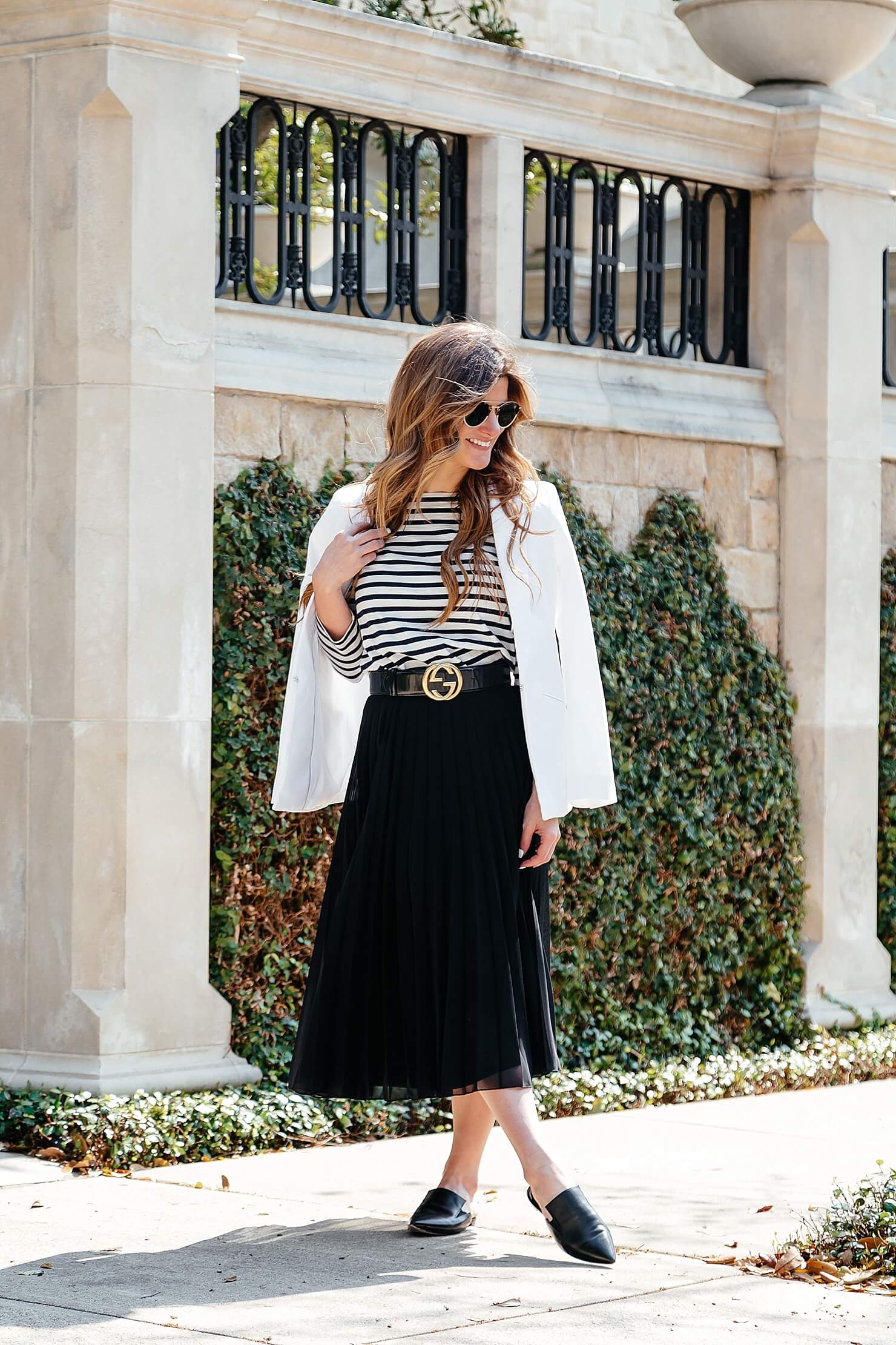 how to dress like a parisian, black and white outfit, black pleated midi skirt, striped tee, gucci belt, pointed toe flats