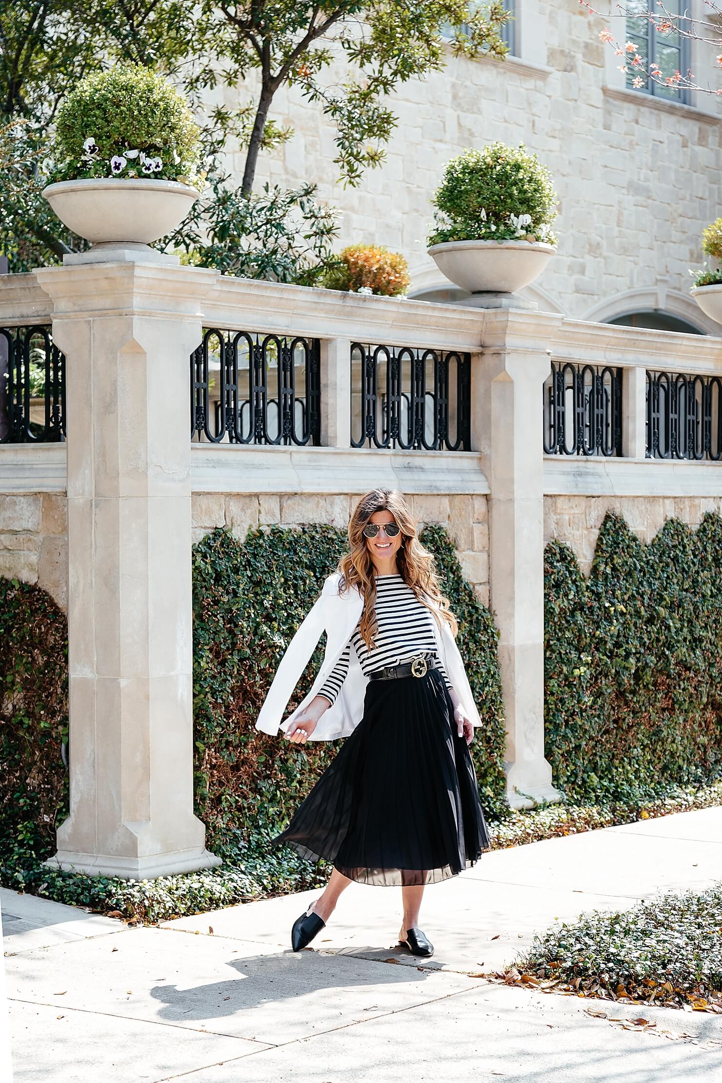 how to dress like a parisian, black and white outfit, black pleated midi skirt, striped tee, gucci belt, pointed toe flats