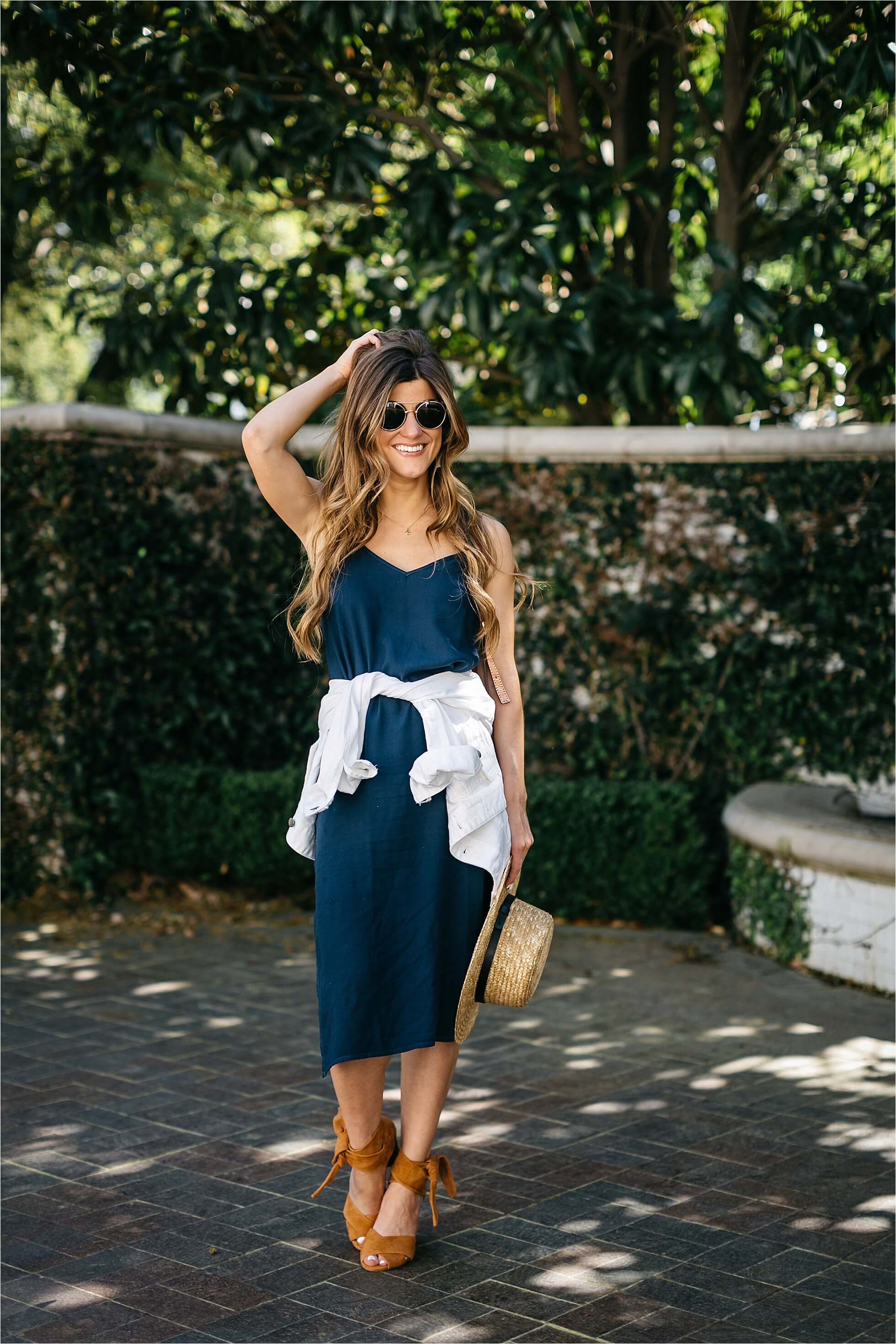 how to style a slip dress, splendid navy midi slip dress, cognac suede shoes, boater hat, chloe drew bag, spring outfit, jacket tied around waist