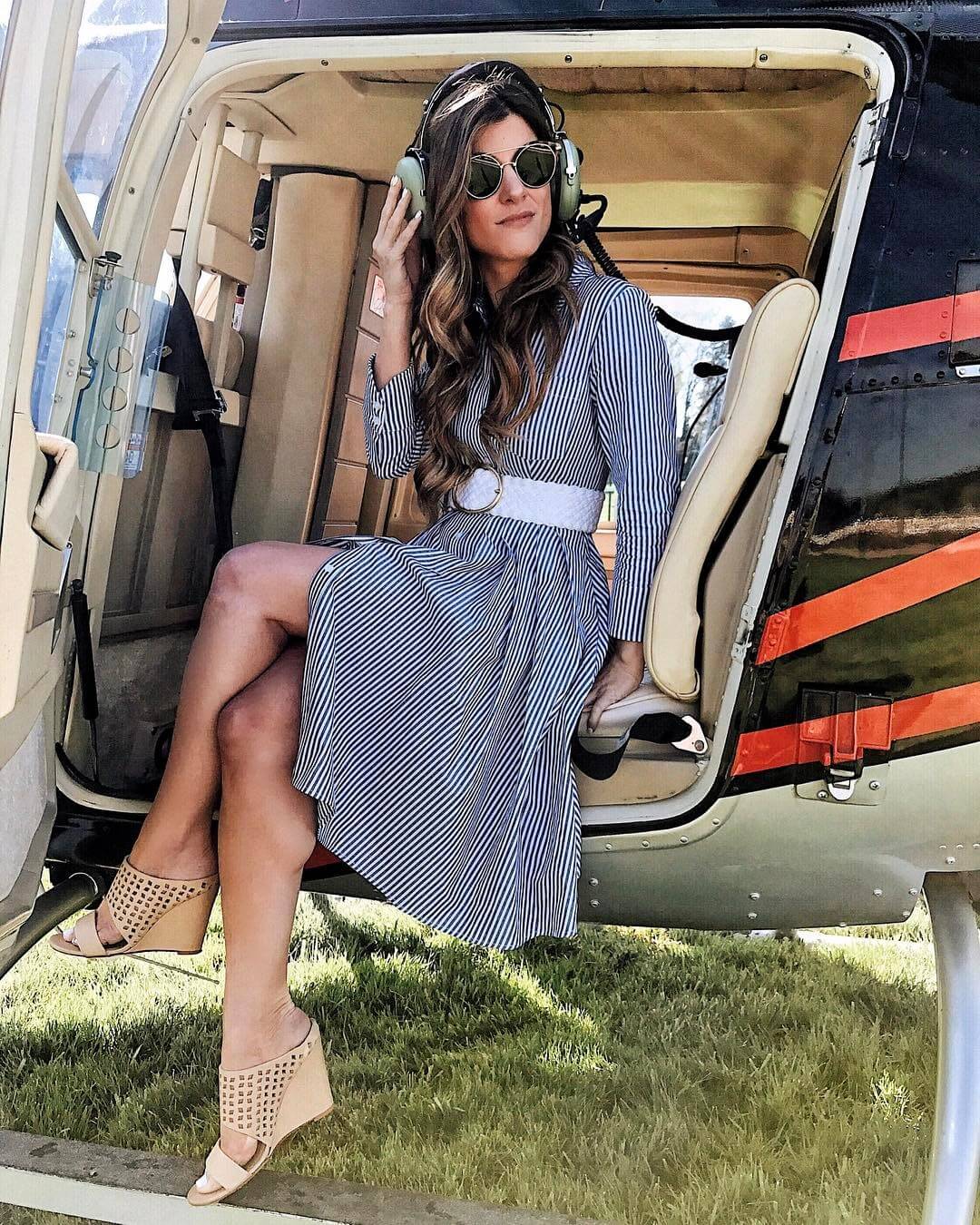 brighten keller helicopter ride outfit wearing striped dress and white belt 