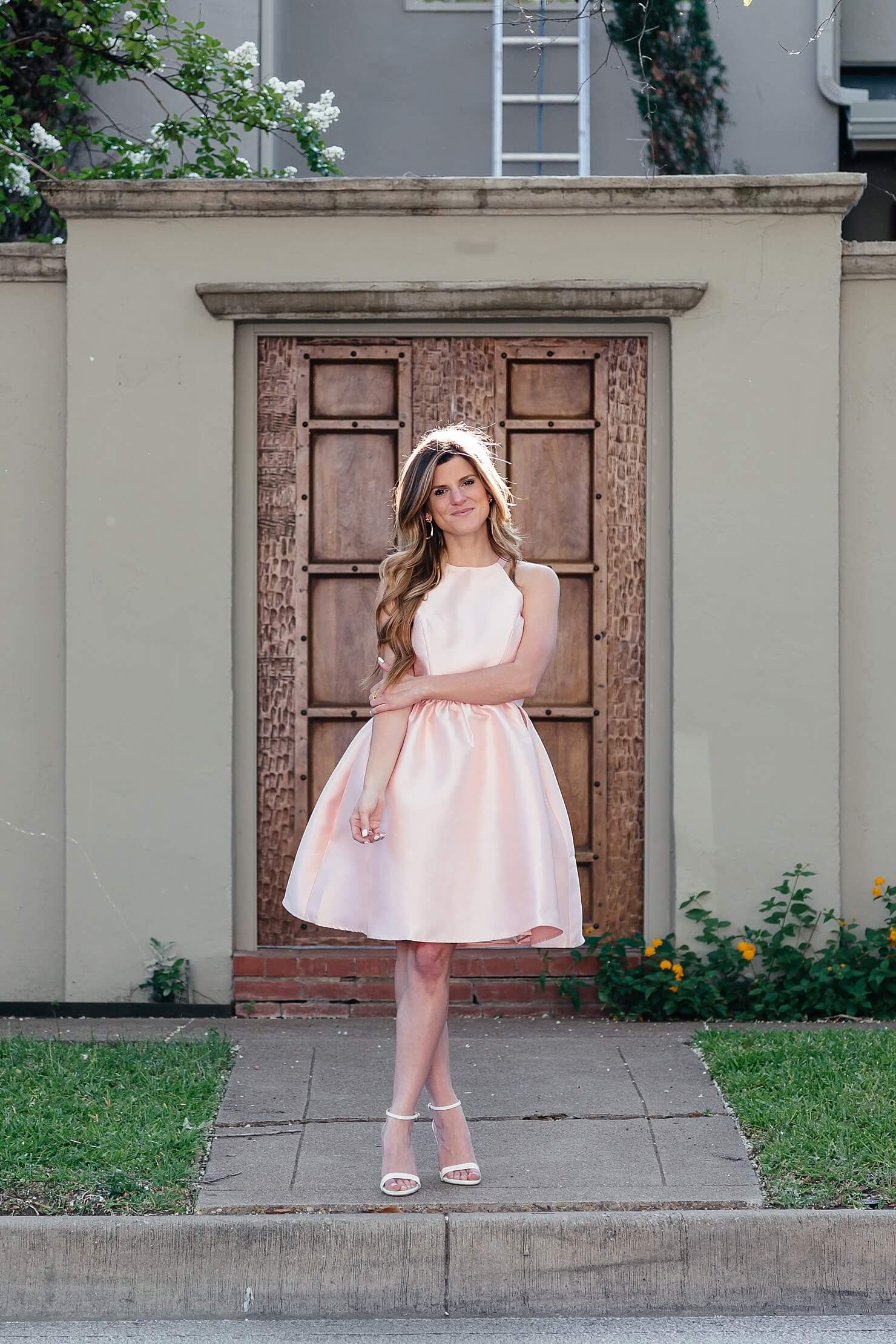 brighton the day wearing blush pink satin dress with white heels for wedding guest outfit