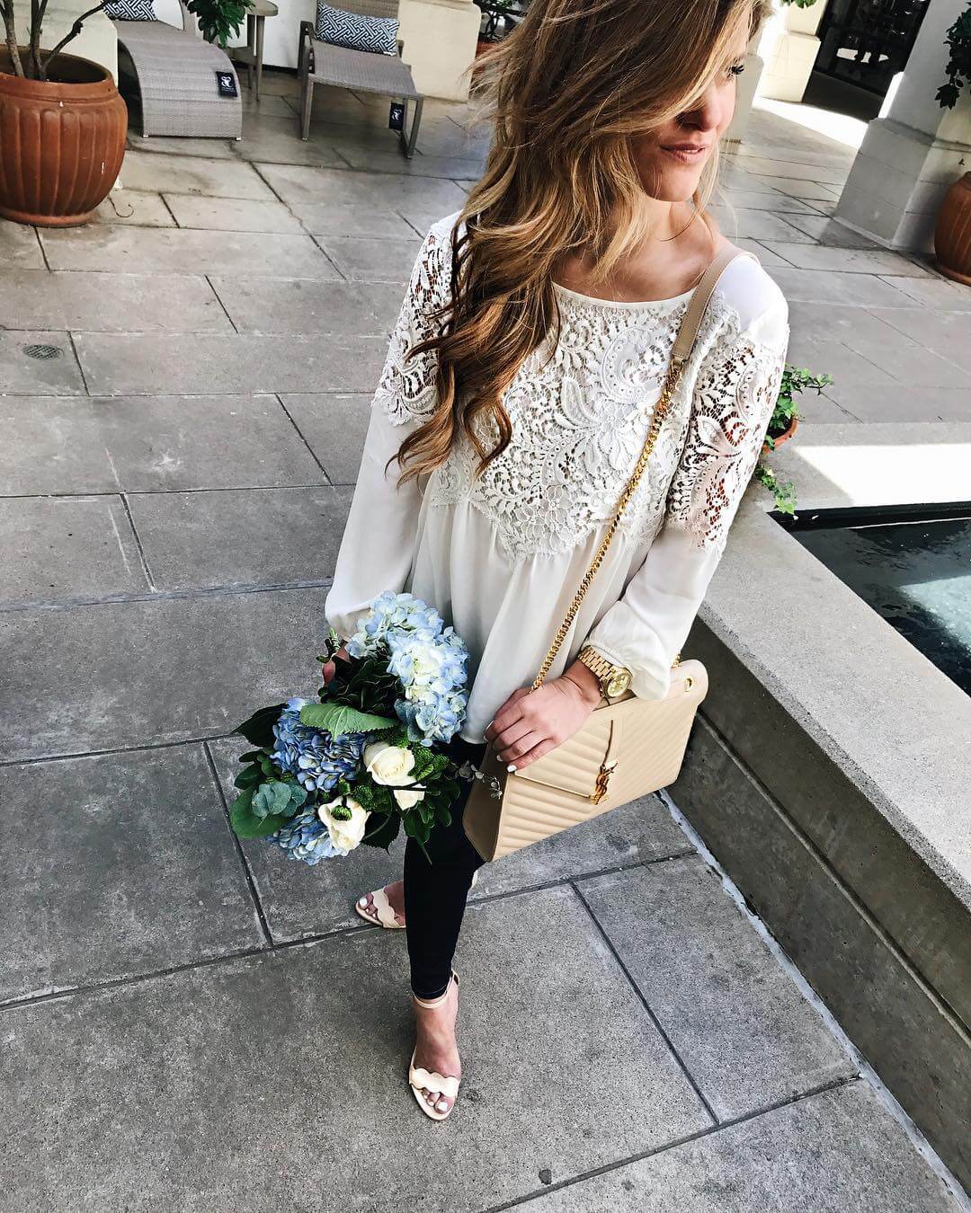 brighten keller wearing lace top with jeans and flowers 