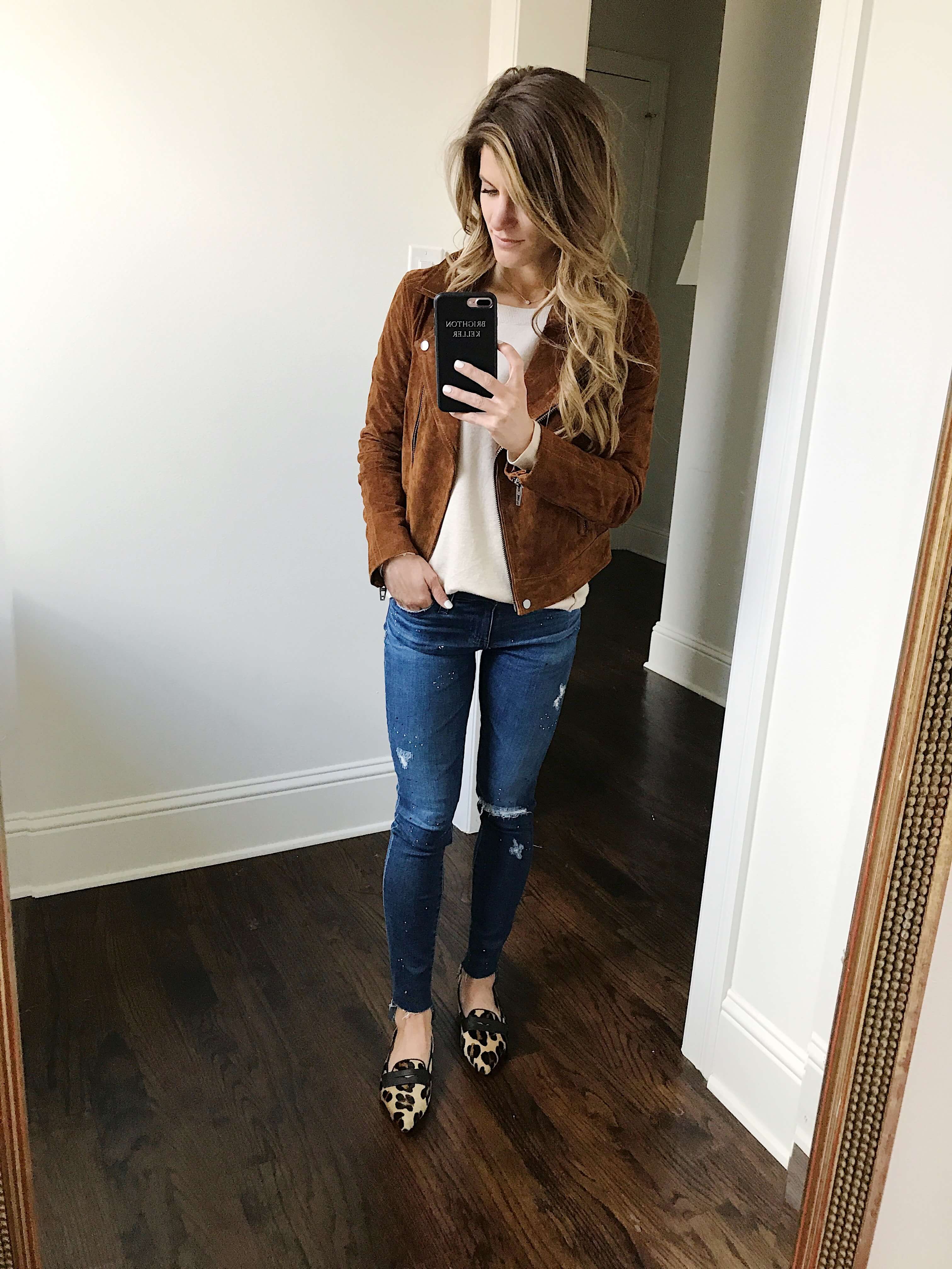 suede moto jacket with cream sweater and ag jeans and leopard shoes