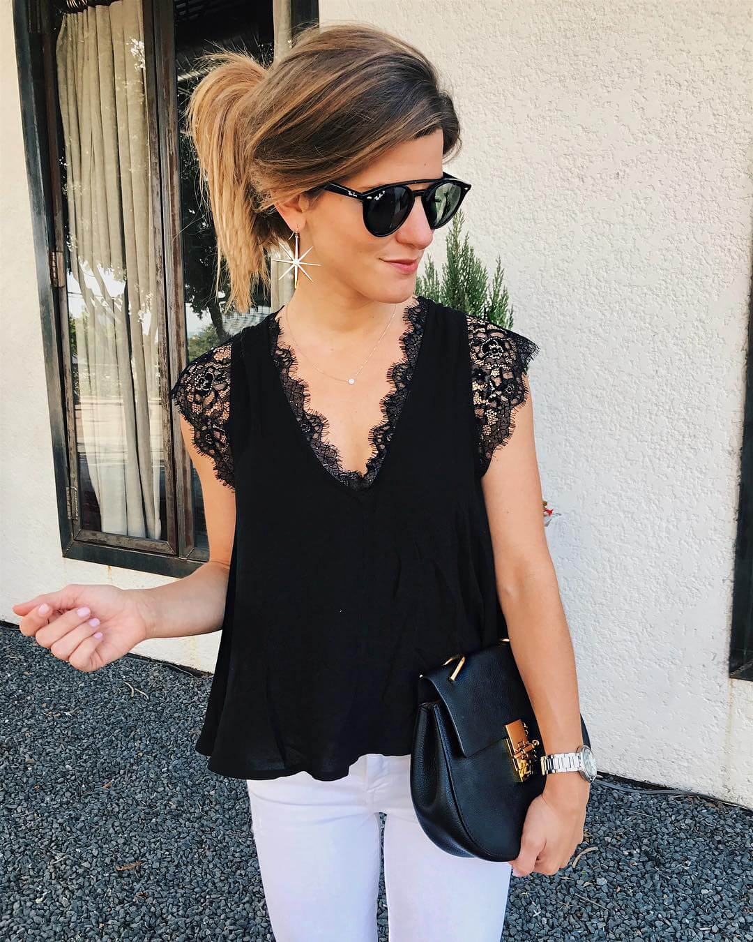 brighton keller wearing black lace top and white jeans 