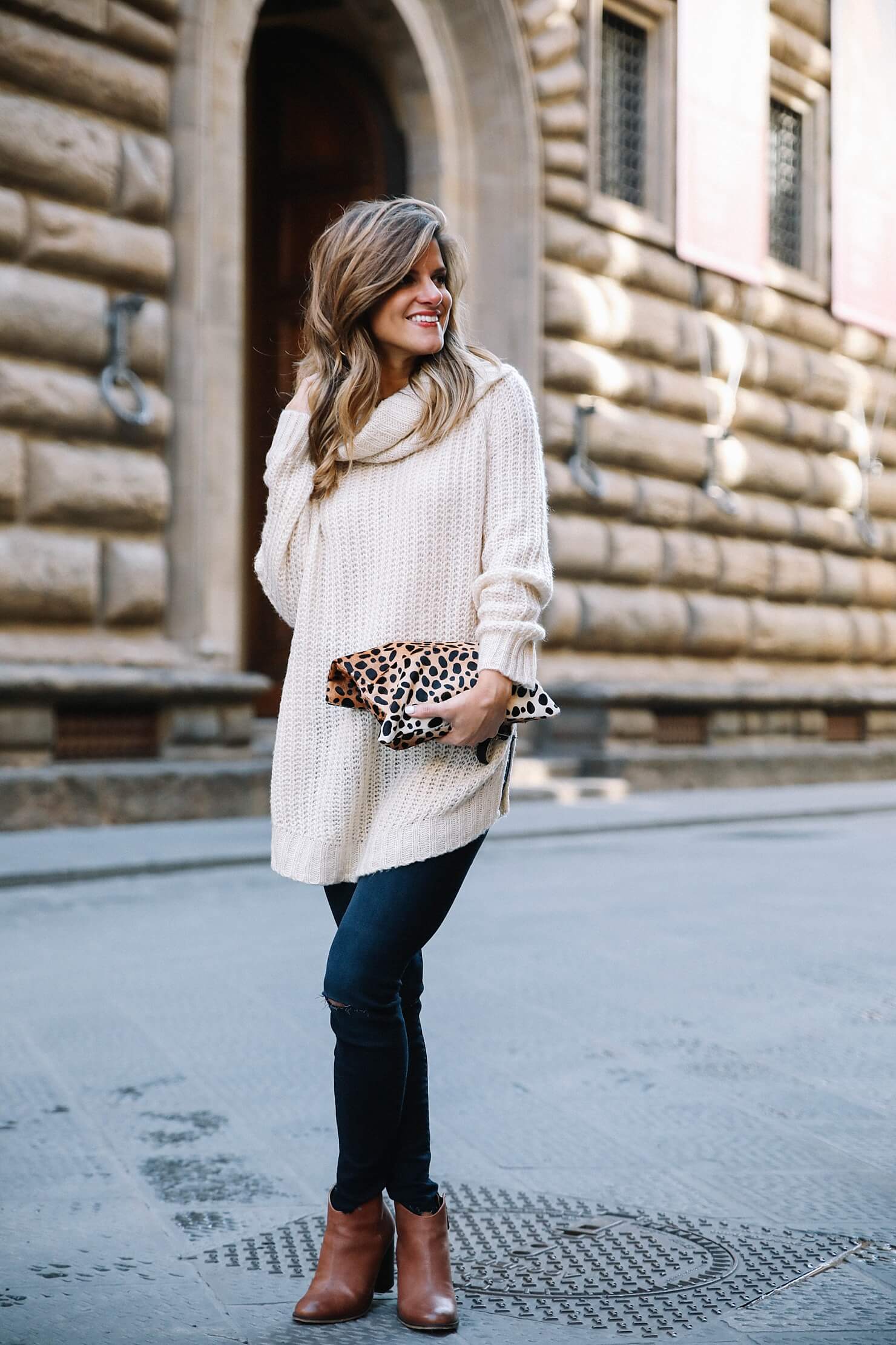 modcloth outfit featuring shawl collar sweater with denim jeans and brown booties and leopard clutch 
