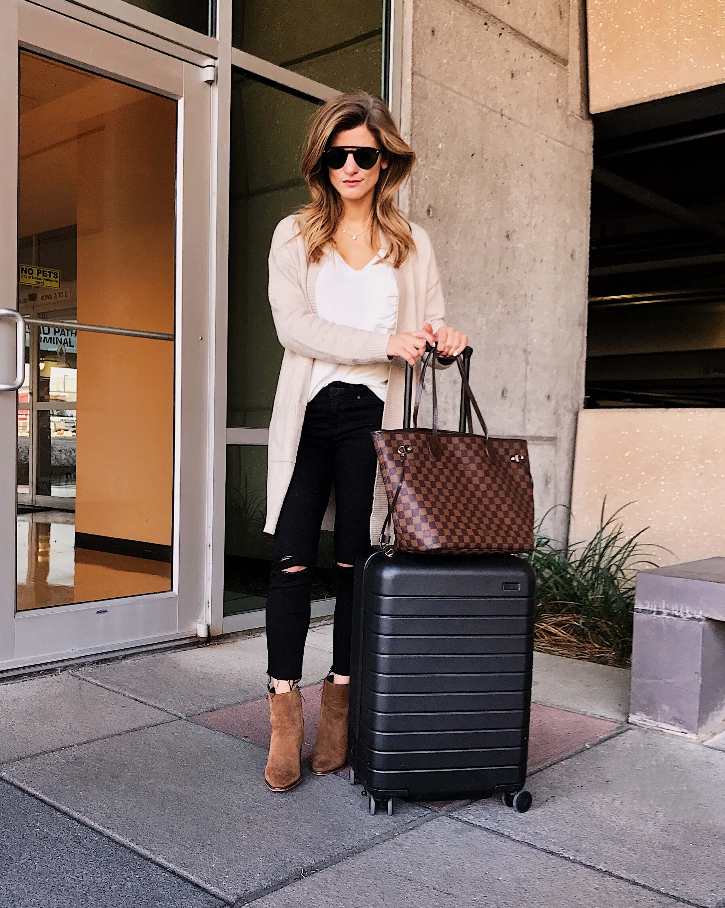 europe travel outfit, black jeans white tee off white cardigan