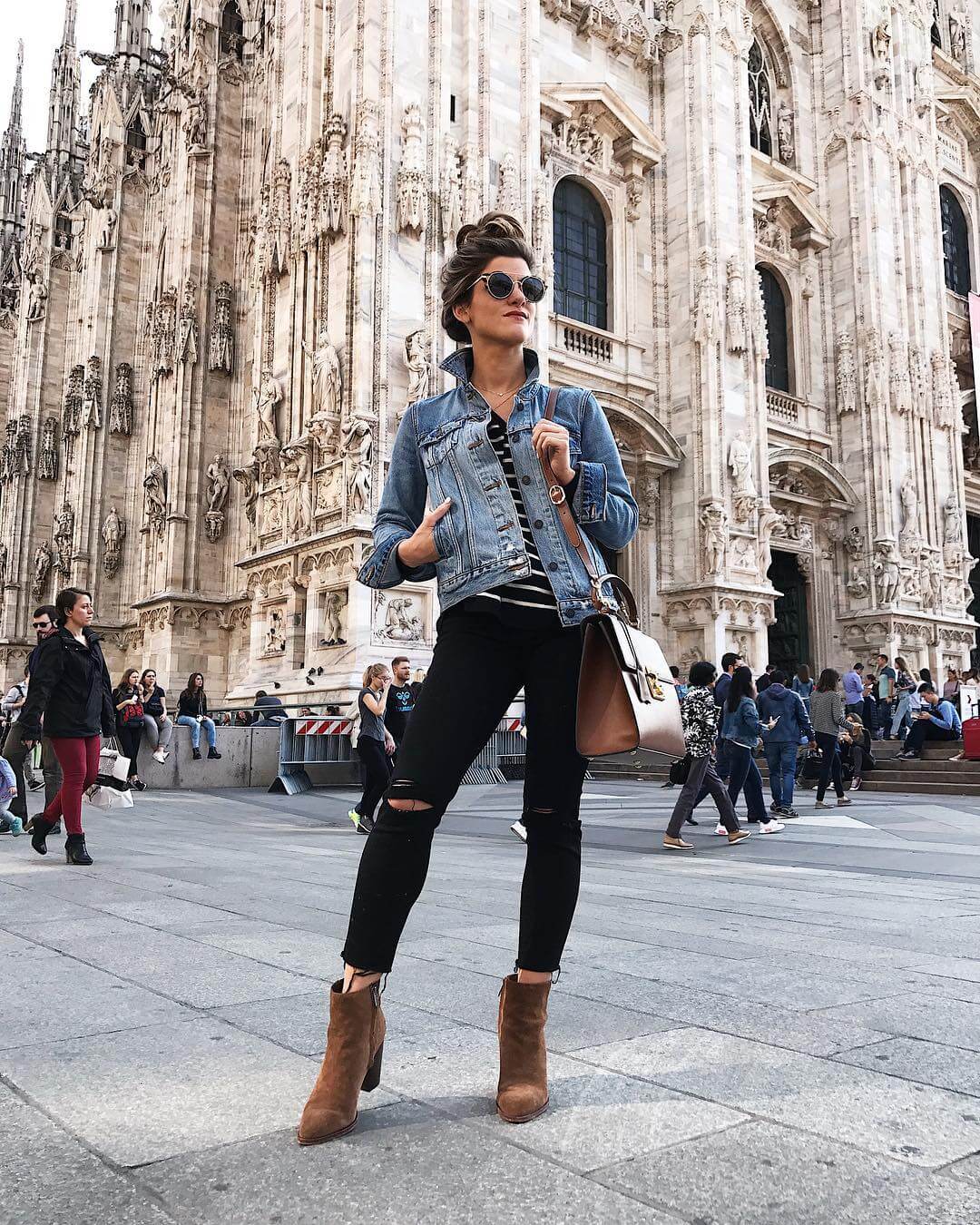 black jeans, striped sweater, brown suede booties and levi's denim jacket outfit in milan, fall outfit idea