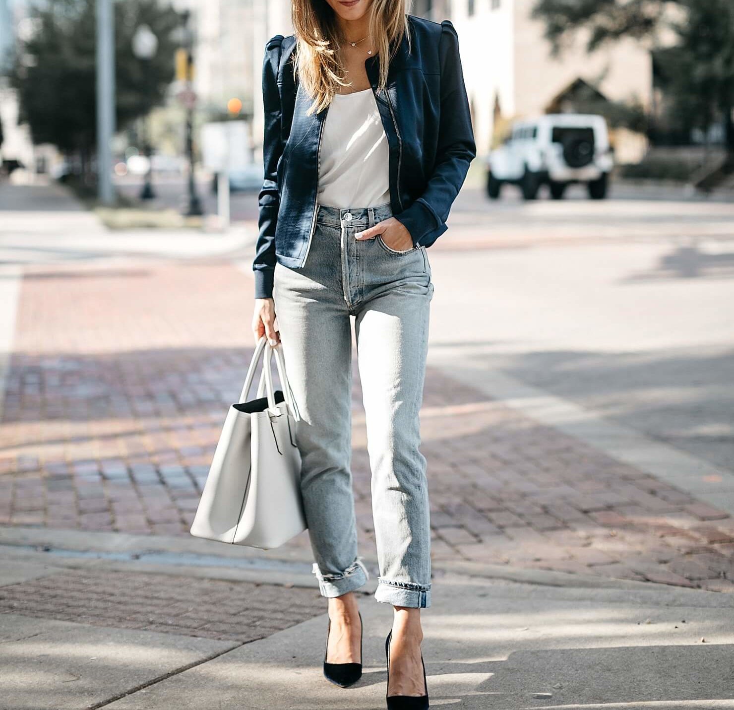 satin bomber, white t-shirt, light jeans, and low blue heel