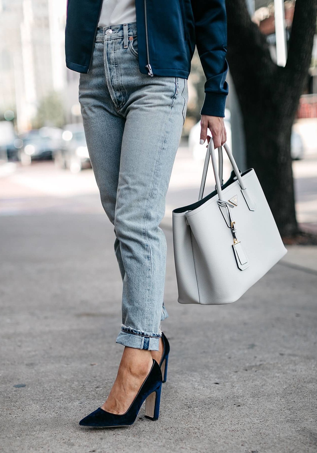 satin bomber, white club monaco camisole, light wash high-waisted mom jeans cuffed at ankle, and dee keller parker navy velvet heel