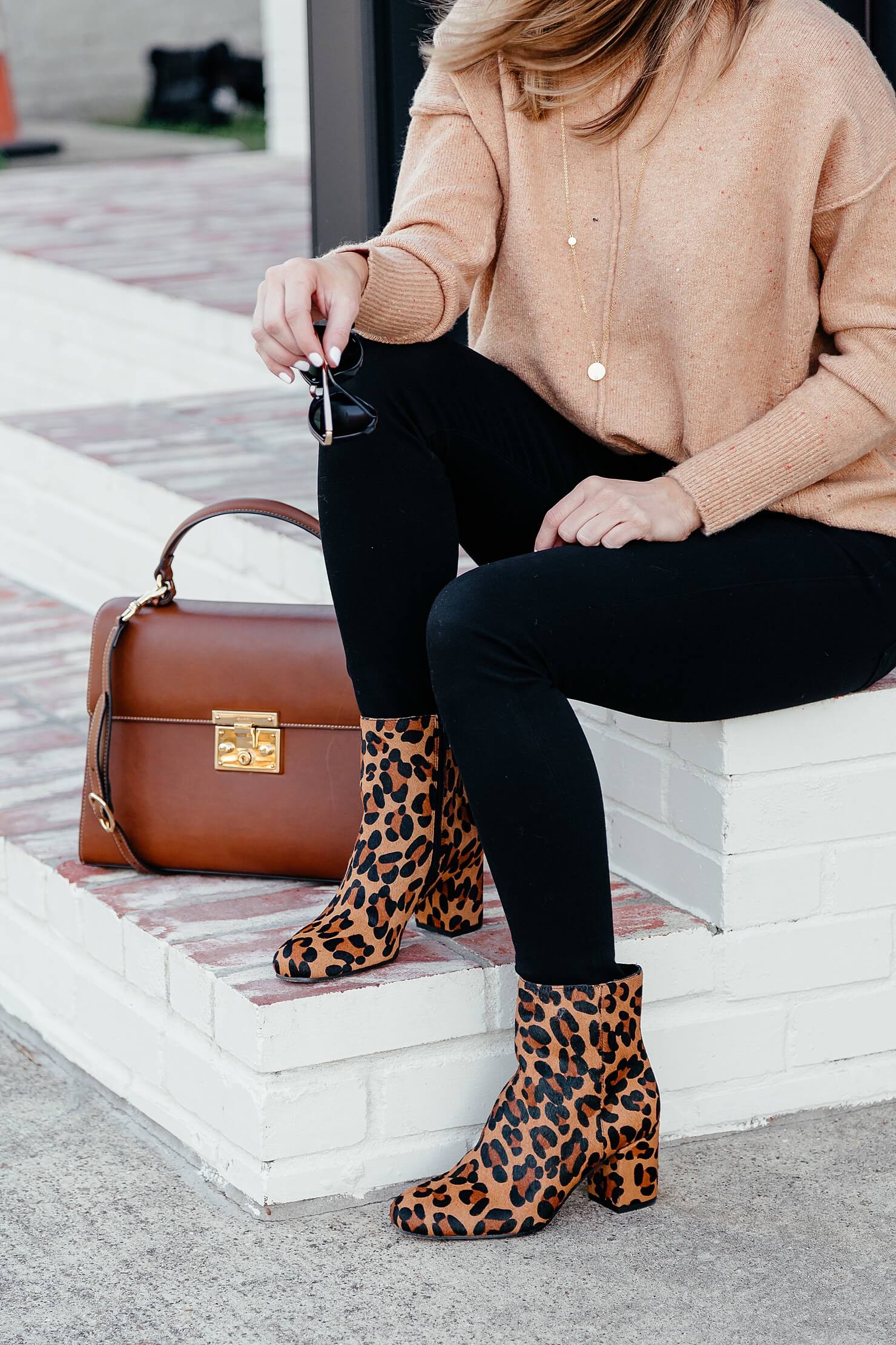camel sweater, black jeans, leopard booties, brown leather bag, and black sunglasses