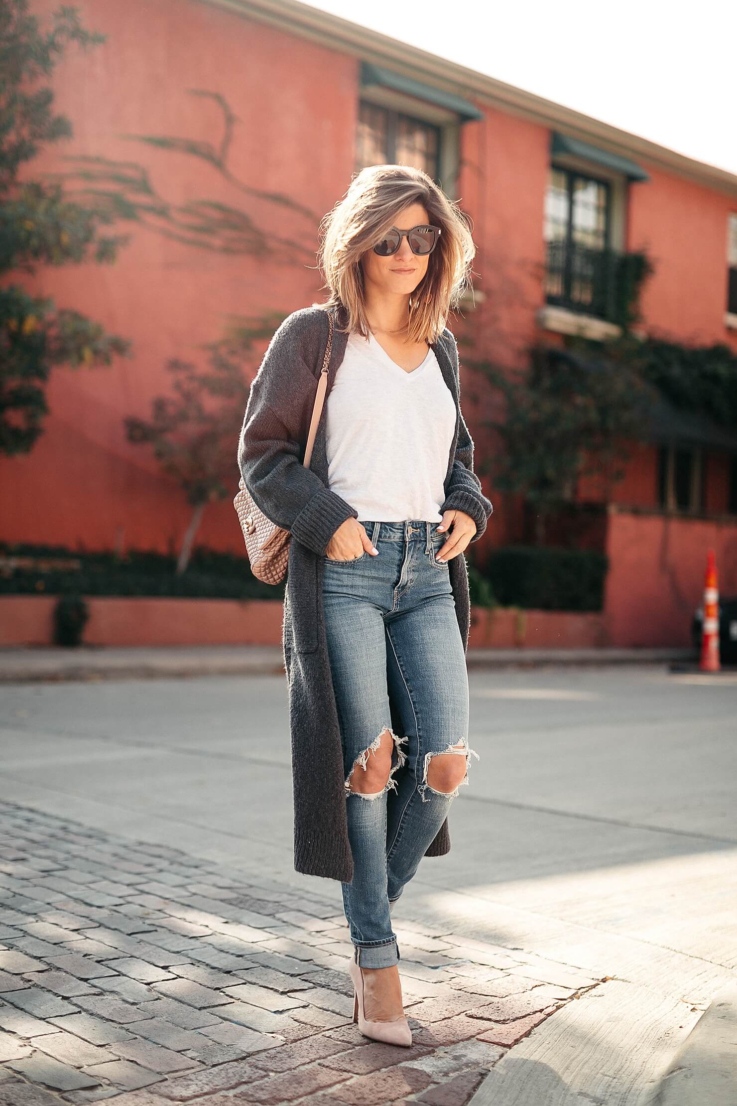 long grey duster outfit with white Monrow tee and Levi's high-rise 721 denim
