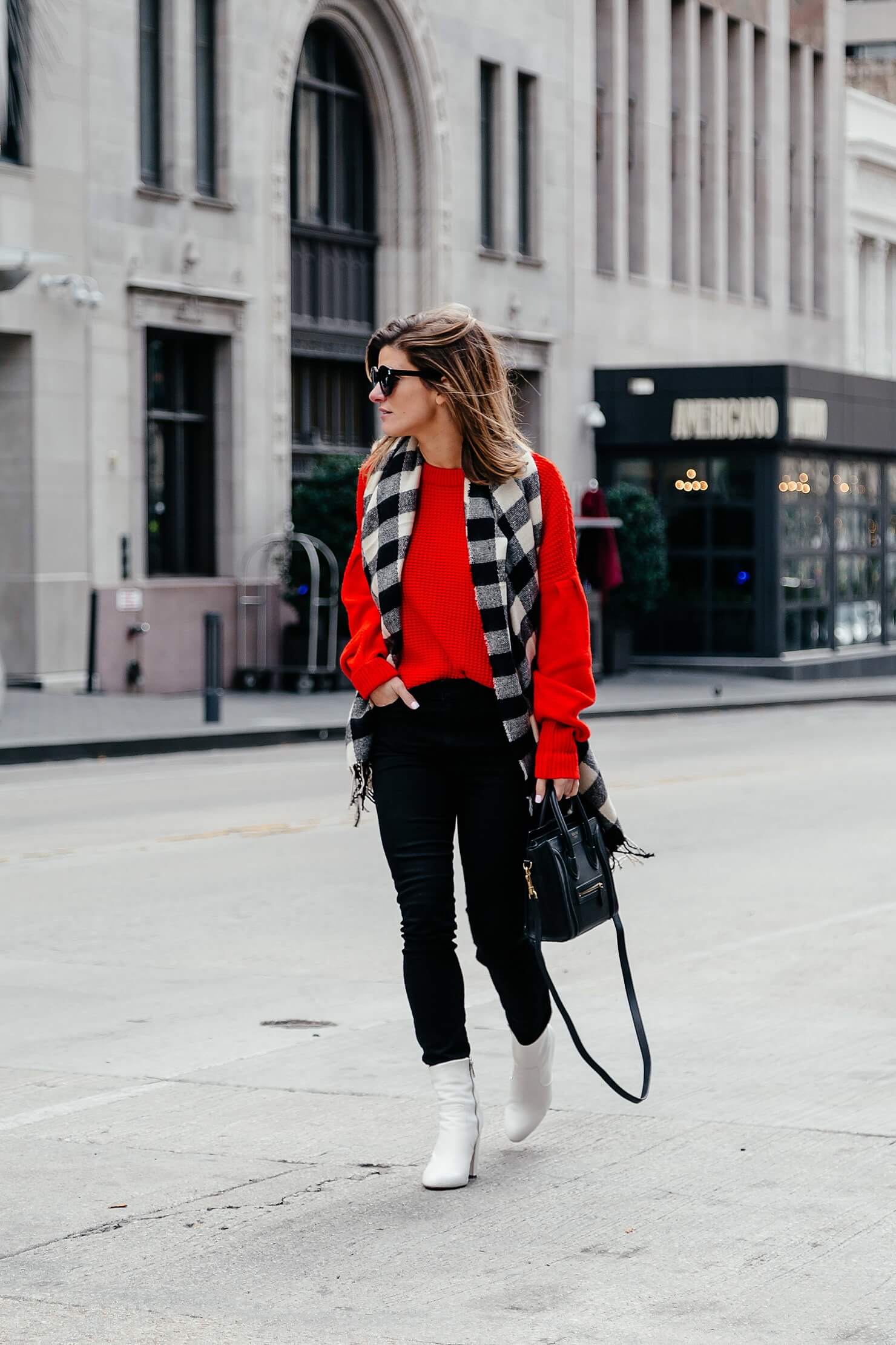 white booties outfit with black jeans, red sweater and buffalo check scarf
