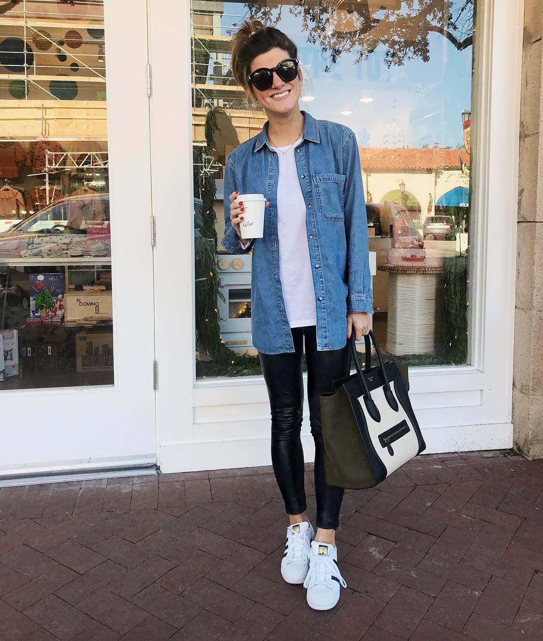 leather leggings outfit with denim chambray shirt and sneakers