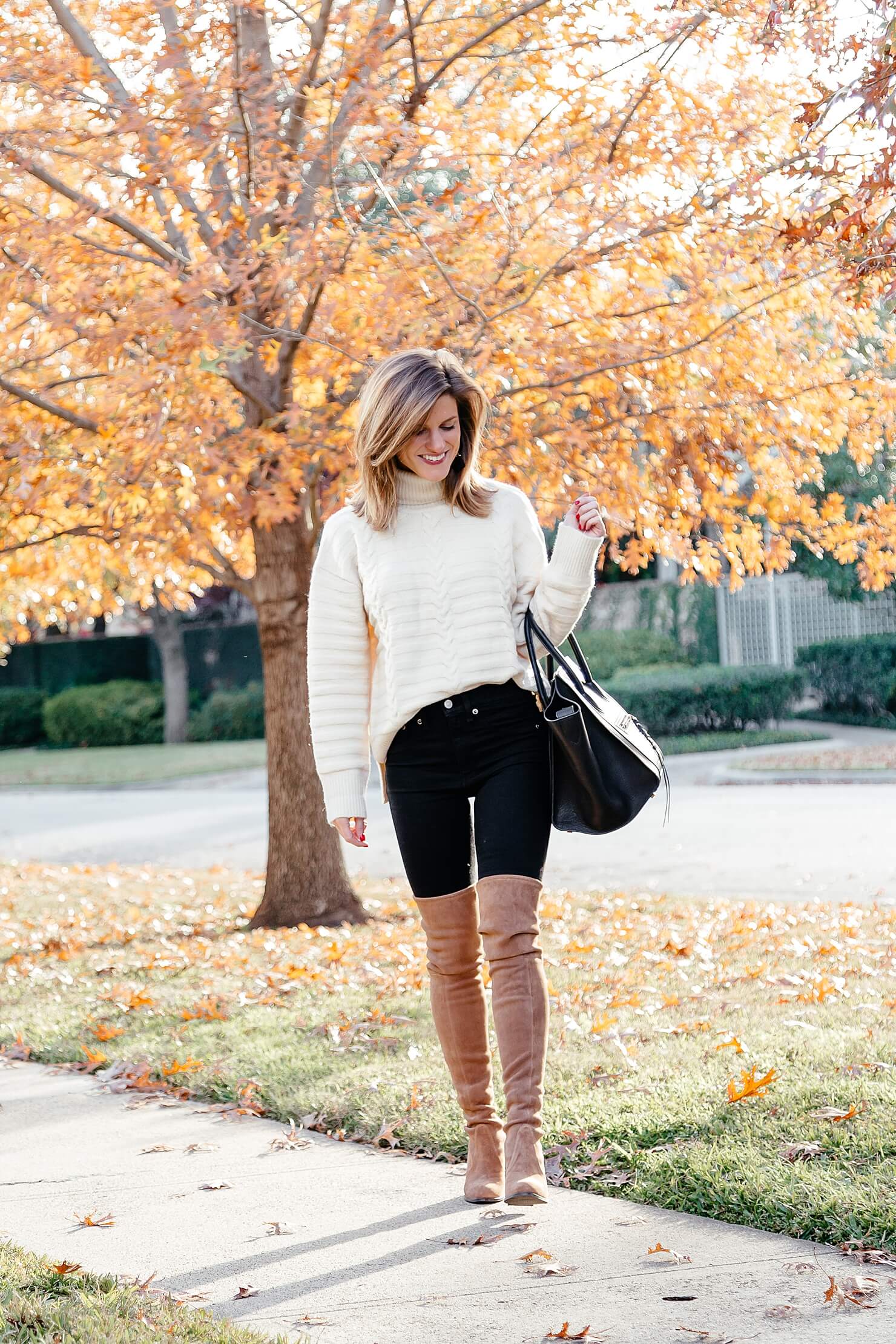 Over the knee boots, black jeans, cream turtleneck sweater