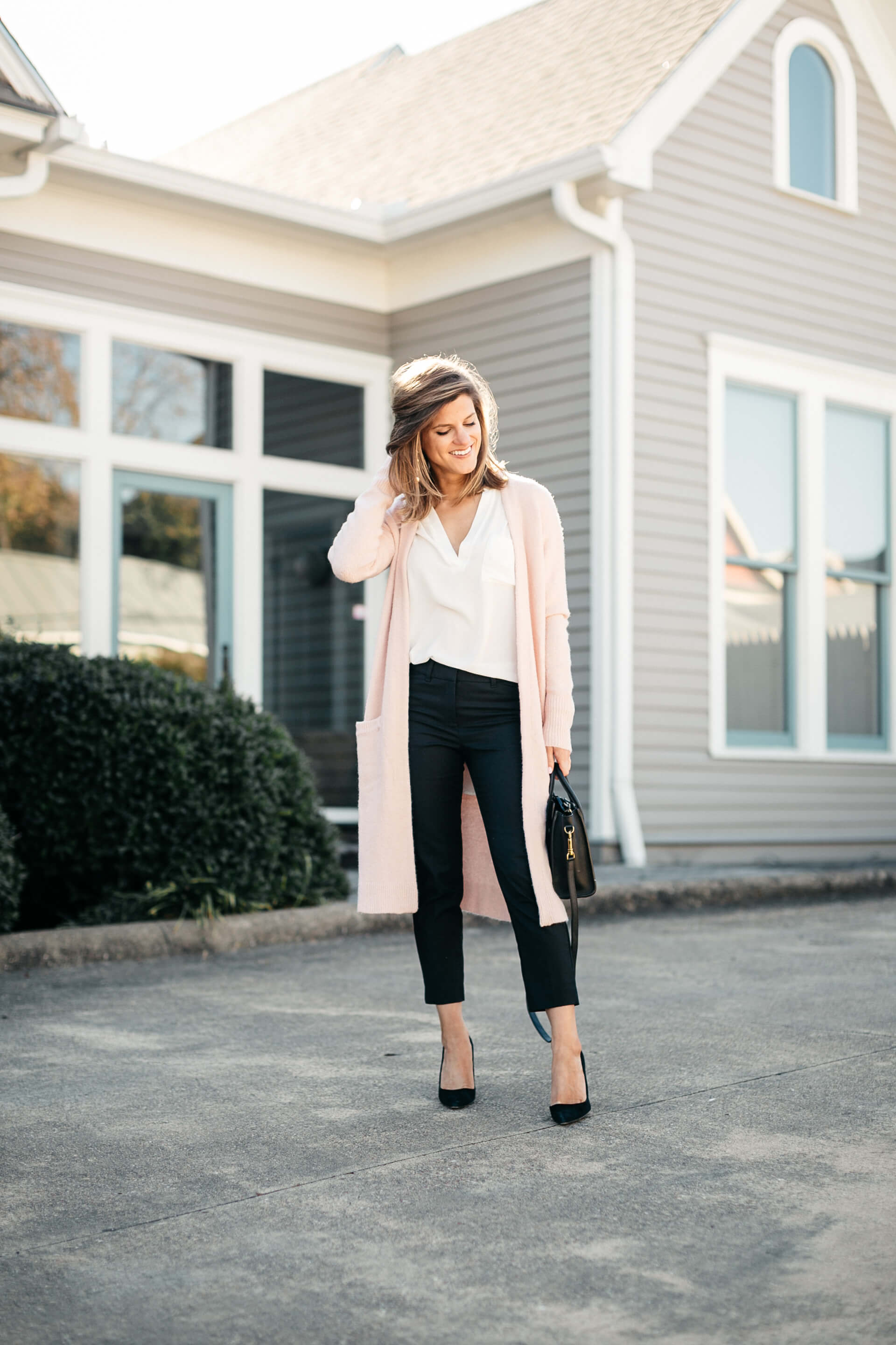 pink cardigan, white lush tunic, and black pants, business casual outfit inspiration