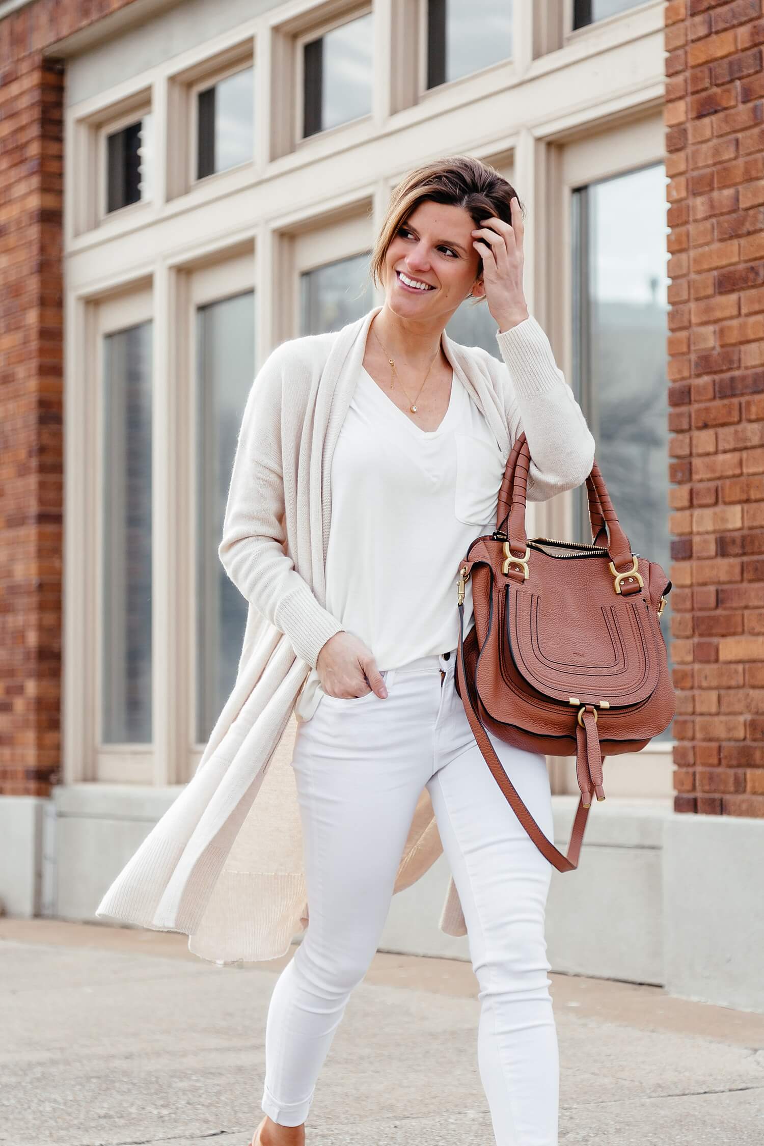 spring neutrals outfit with white jeans and cream cardigan