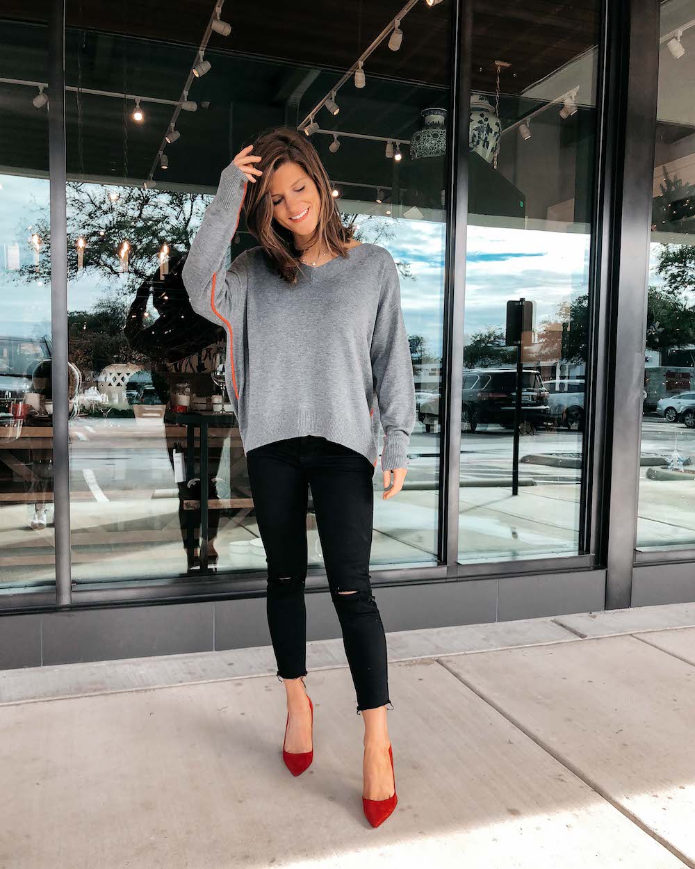 grey sweater black jeans with red suede dee keller pumps date night outfit