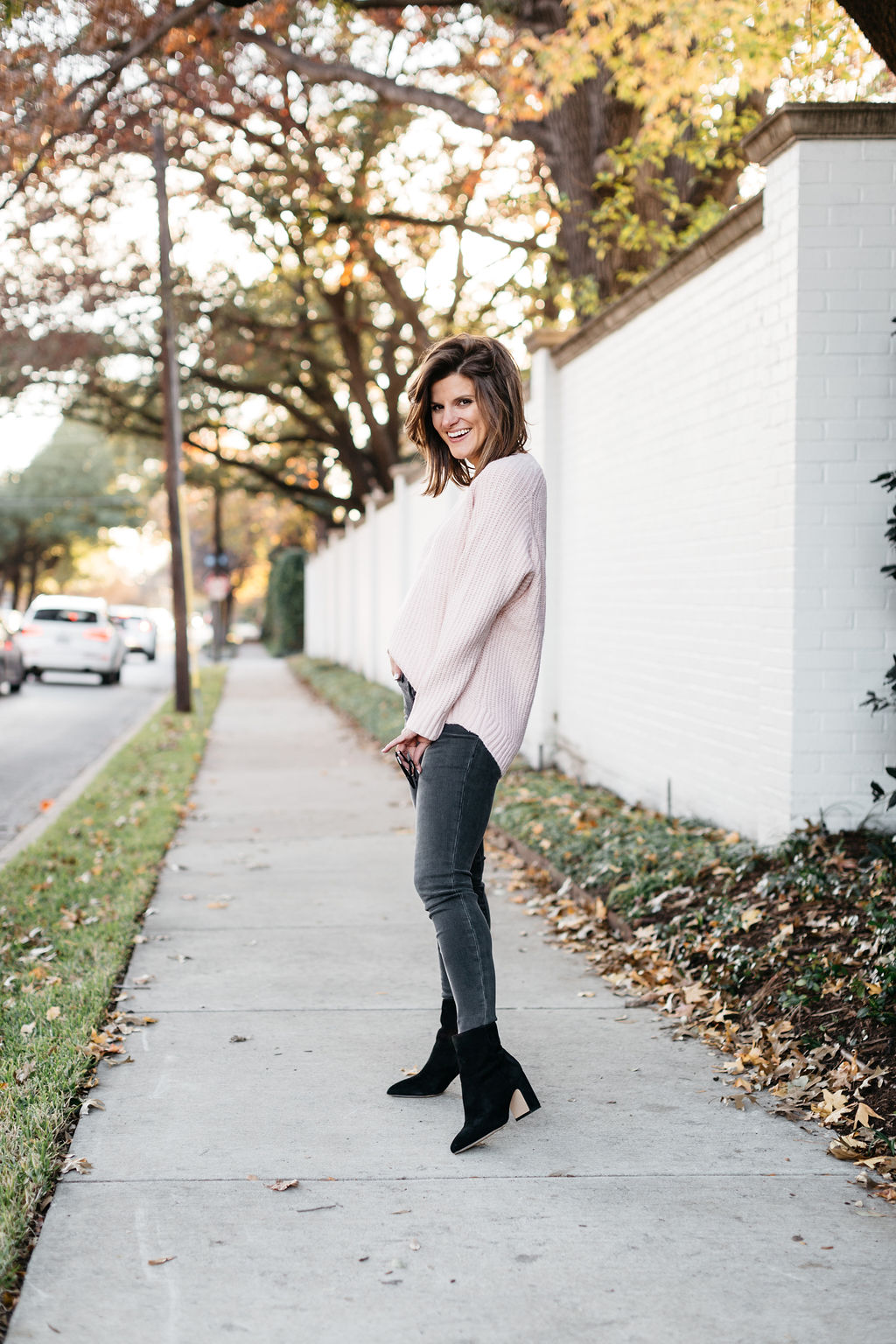 grey jeans pink sweater and black booties 