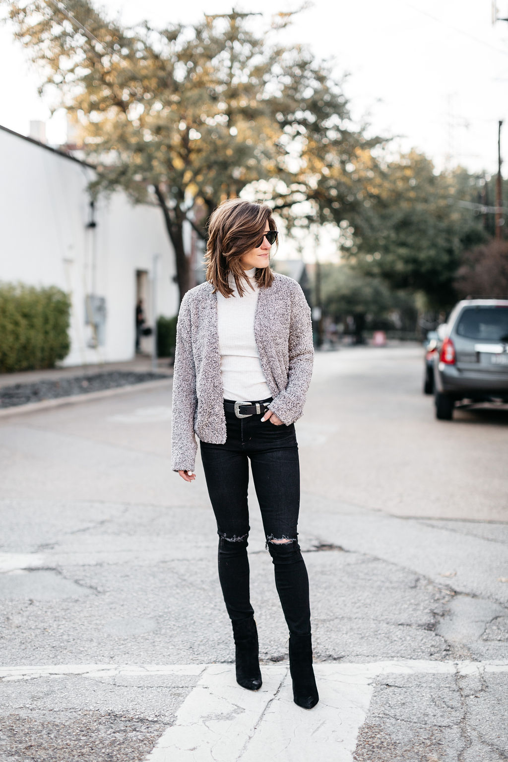 winter outfit black jeans cream turtleneck cropped cardigan western belt