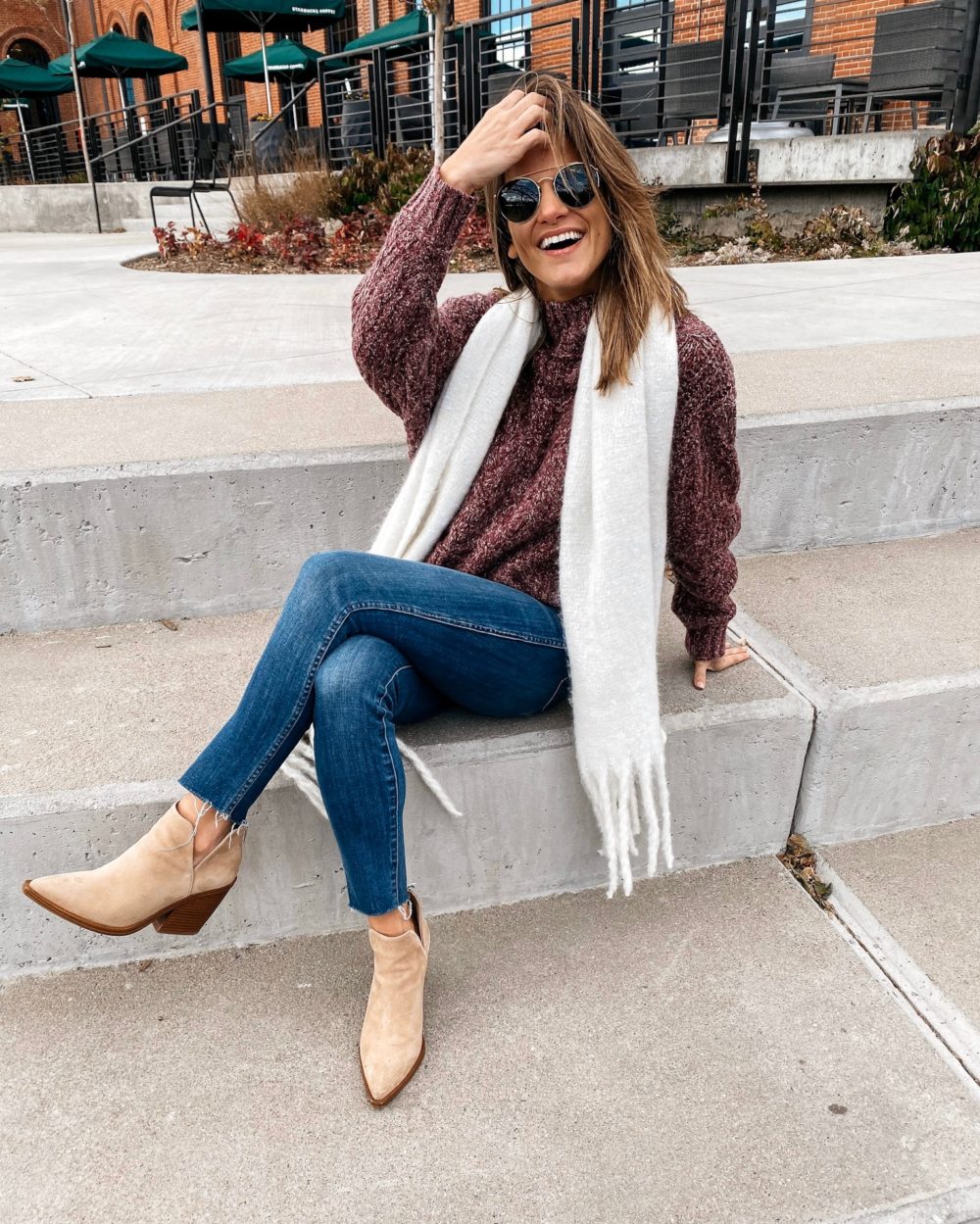 maroon chenille sweater with white scarf jeans and booties