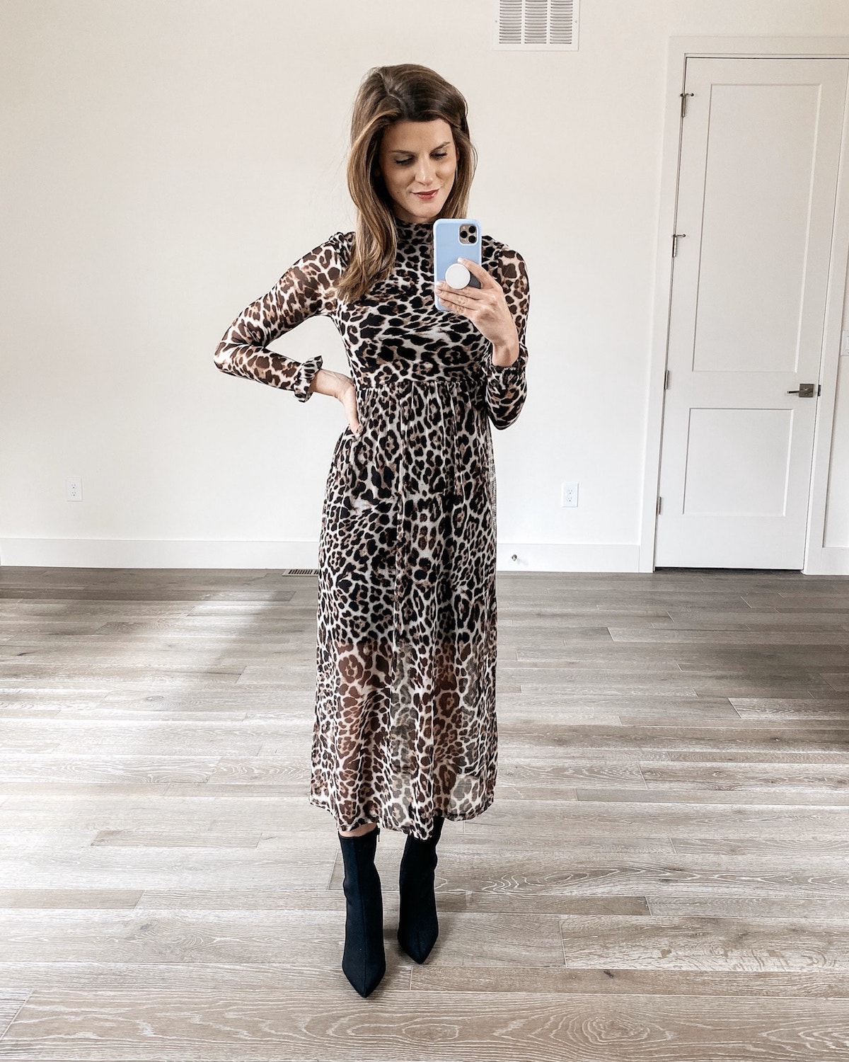 Brighton Keller wearing leopard dress and sock booties
