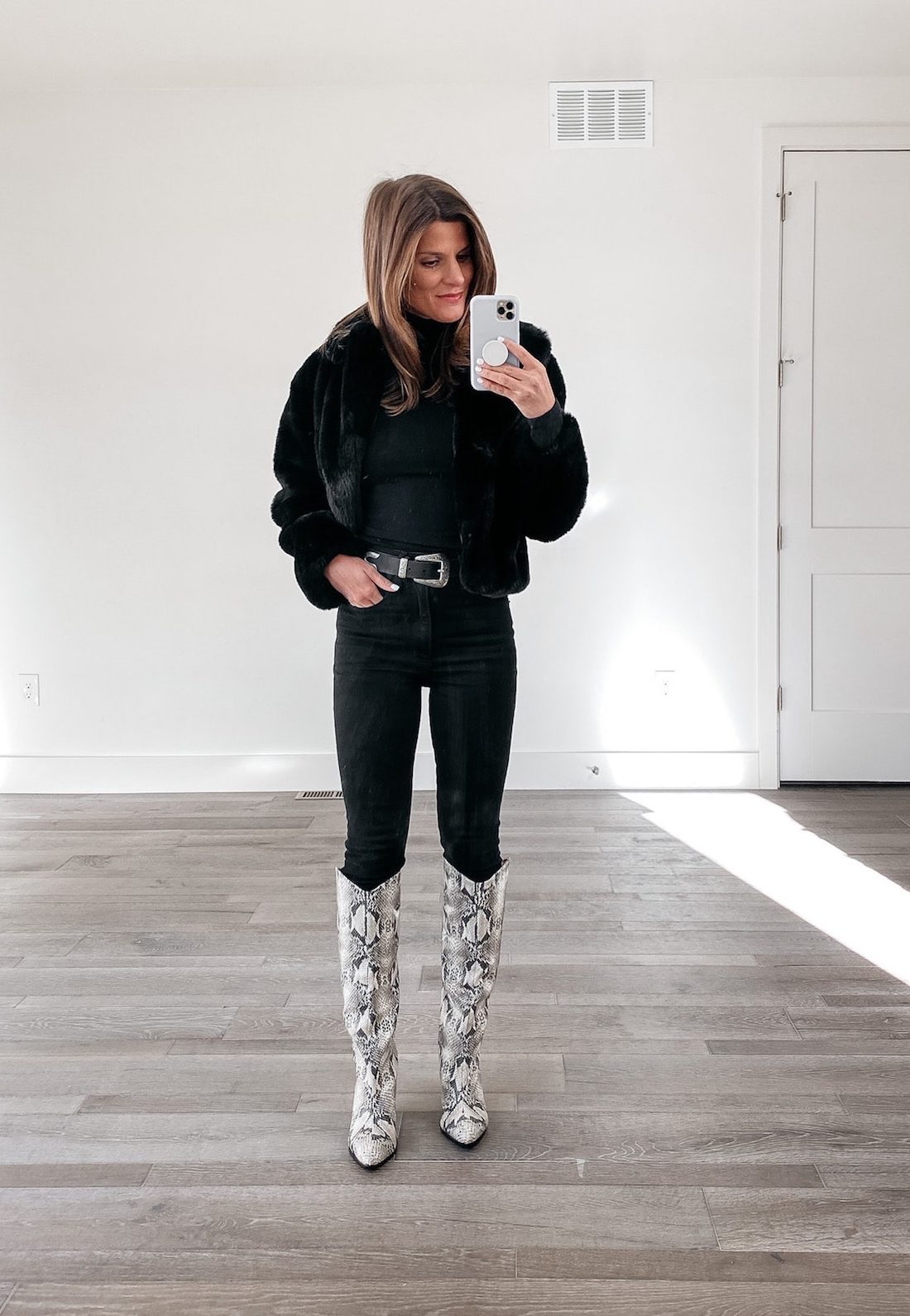 how to style a black turtleneck, all black outfit, winter outfit with snakeskin tall boots