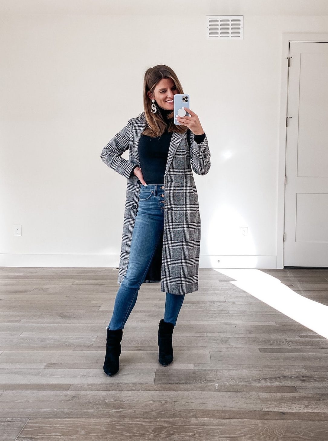 how to style a black turtleneck, winter outfit , long plaid coat, black booties, wide leg jeans