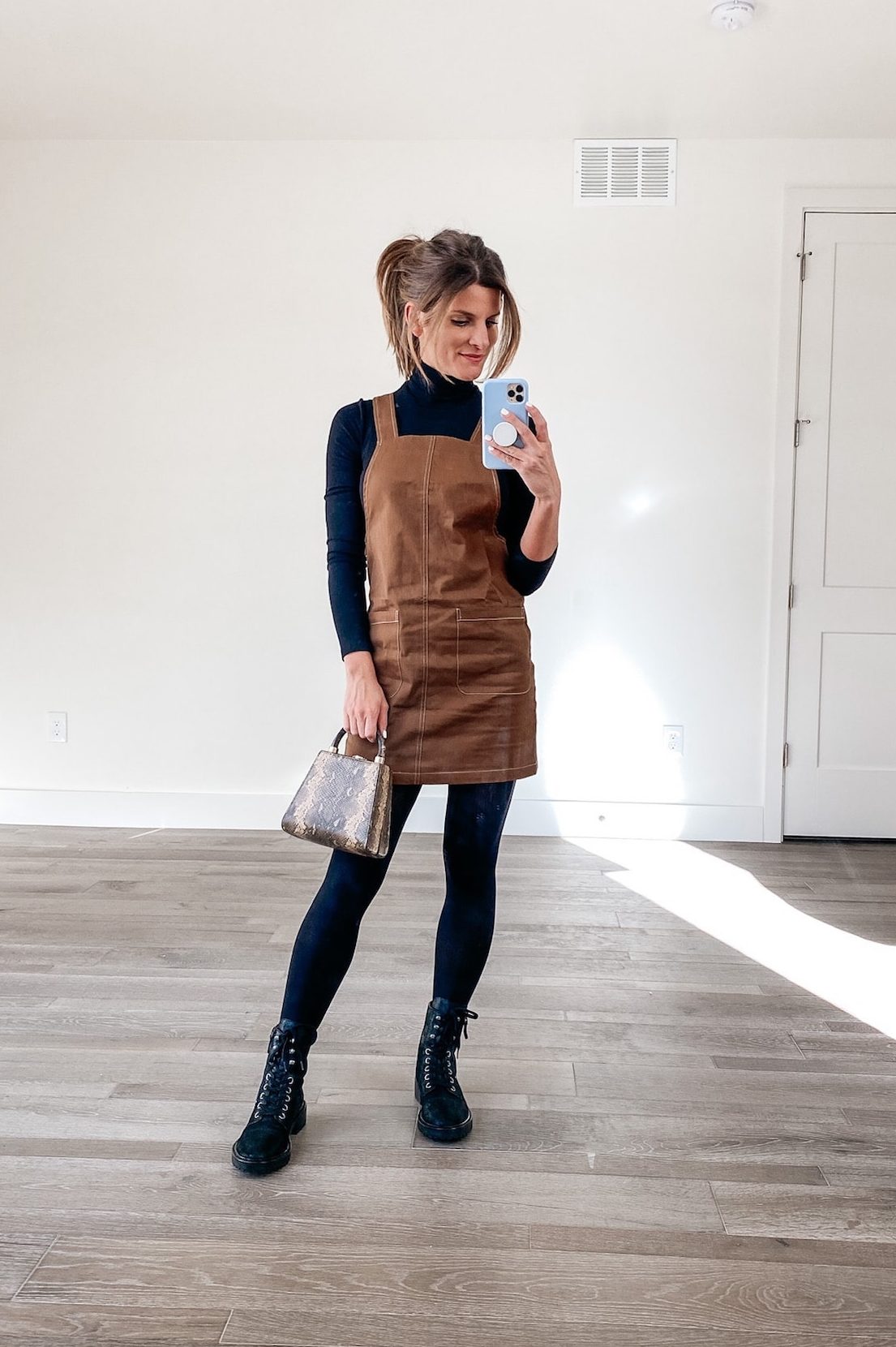 how to style a black turtleneck, black turtleneck, combat boots, black tights winter outfit