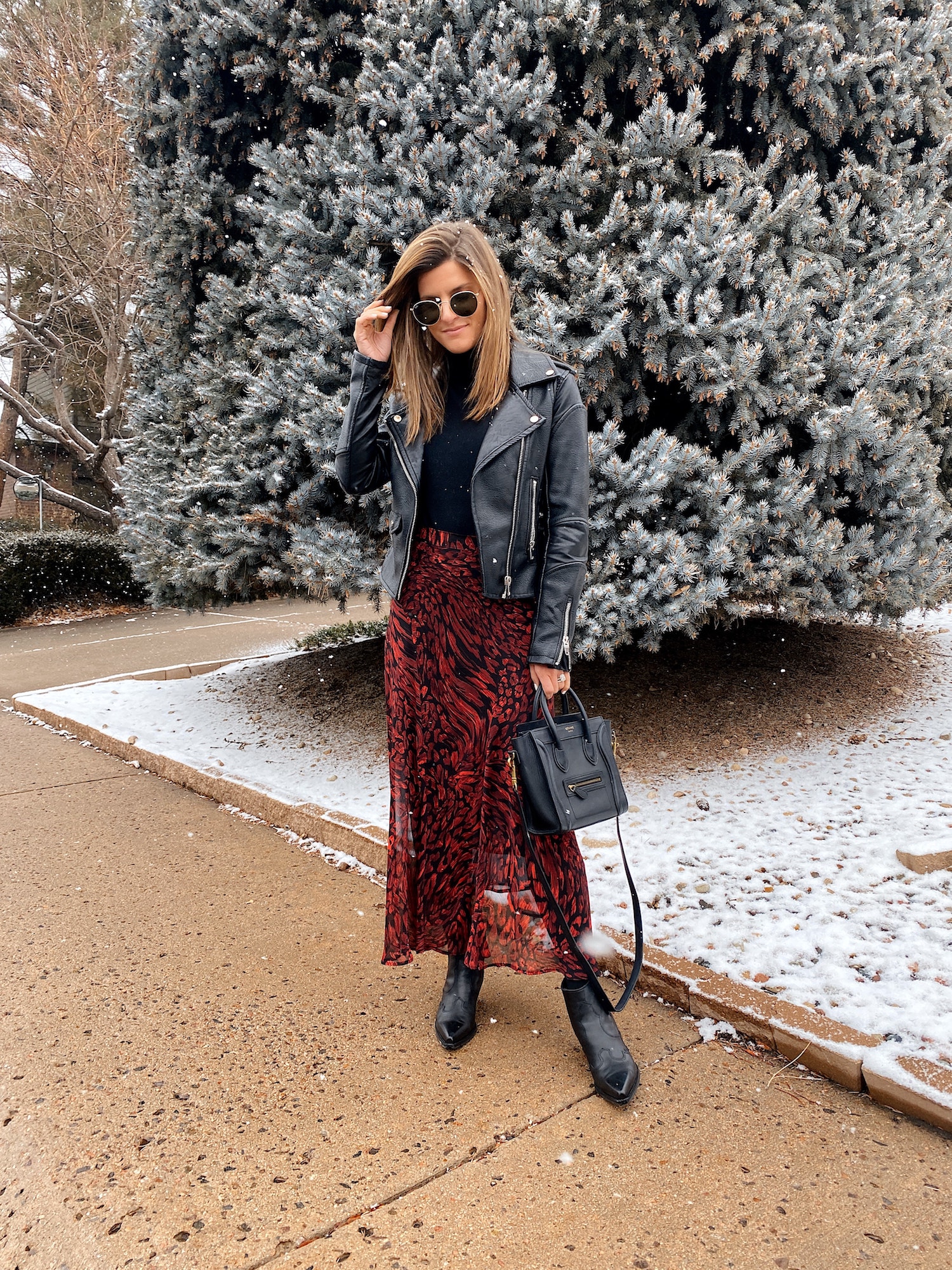 winter outfit, business casual winter outfit, red and black midi skirt, black booties, black tights, moto jacket, black turtleneck
