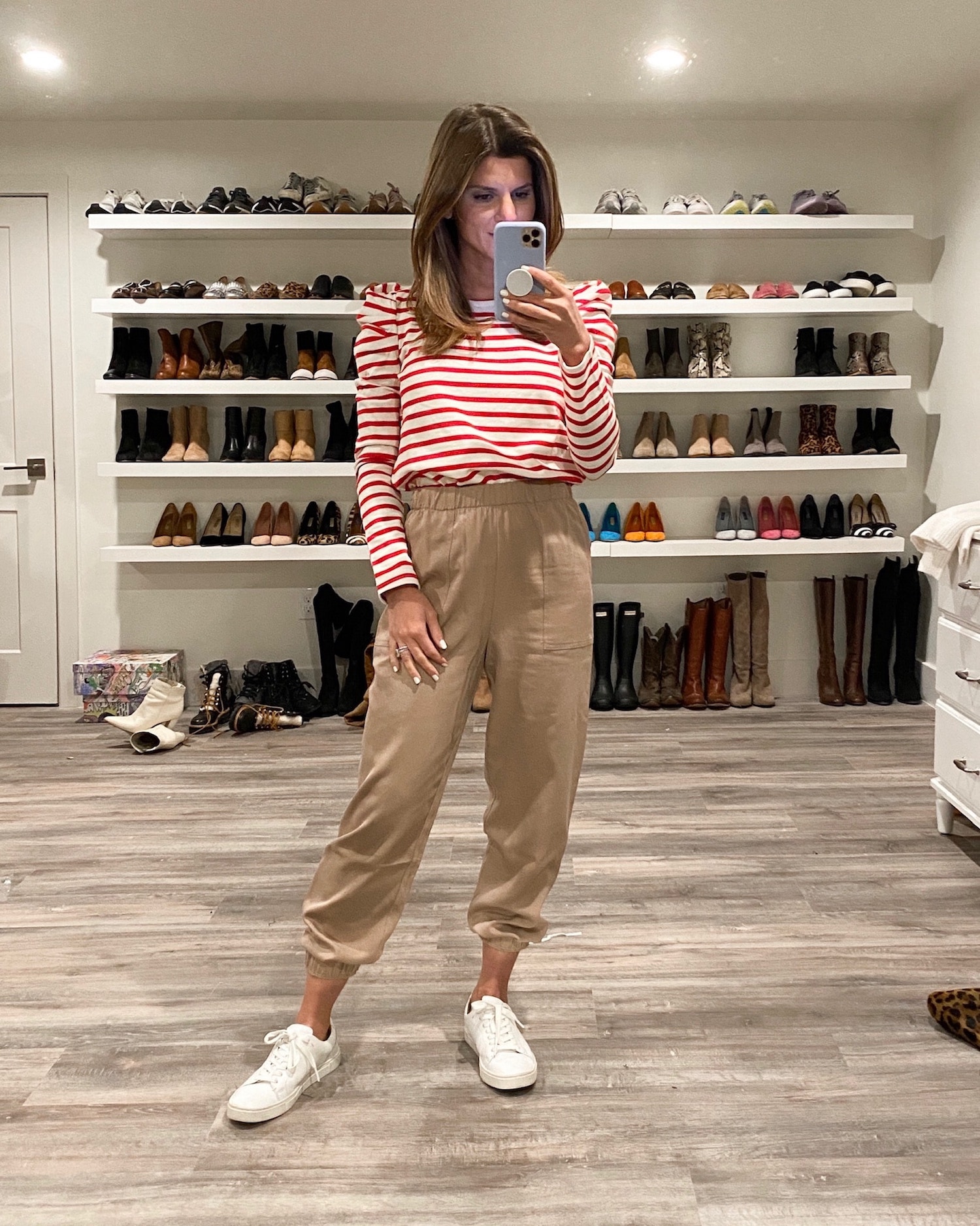Brighton Keller wearing red and white striped top, joggers and white tennis shoes