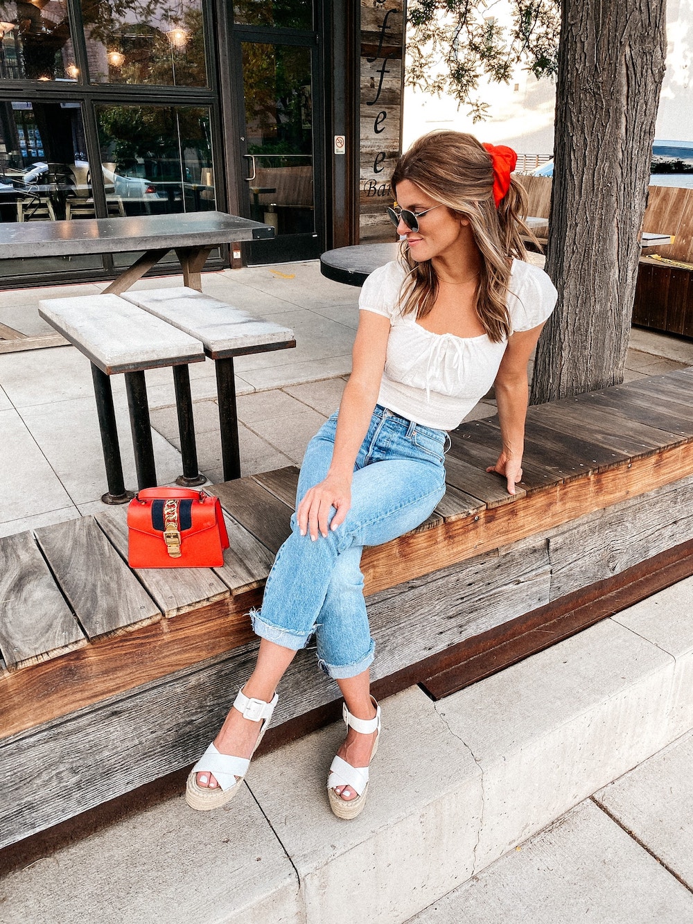 Brighton Butler 4th of July outfit with jeans, white top, and wedges 4th of July sale