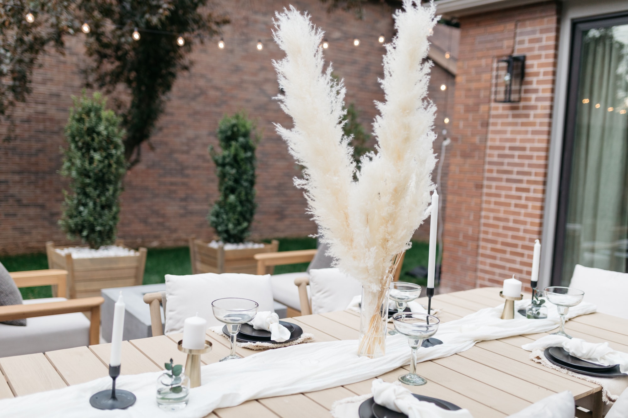 brighton butler outdoor table set up pampas grass Mexican dinner, pampas tables cape, boho table