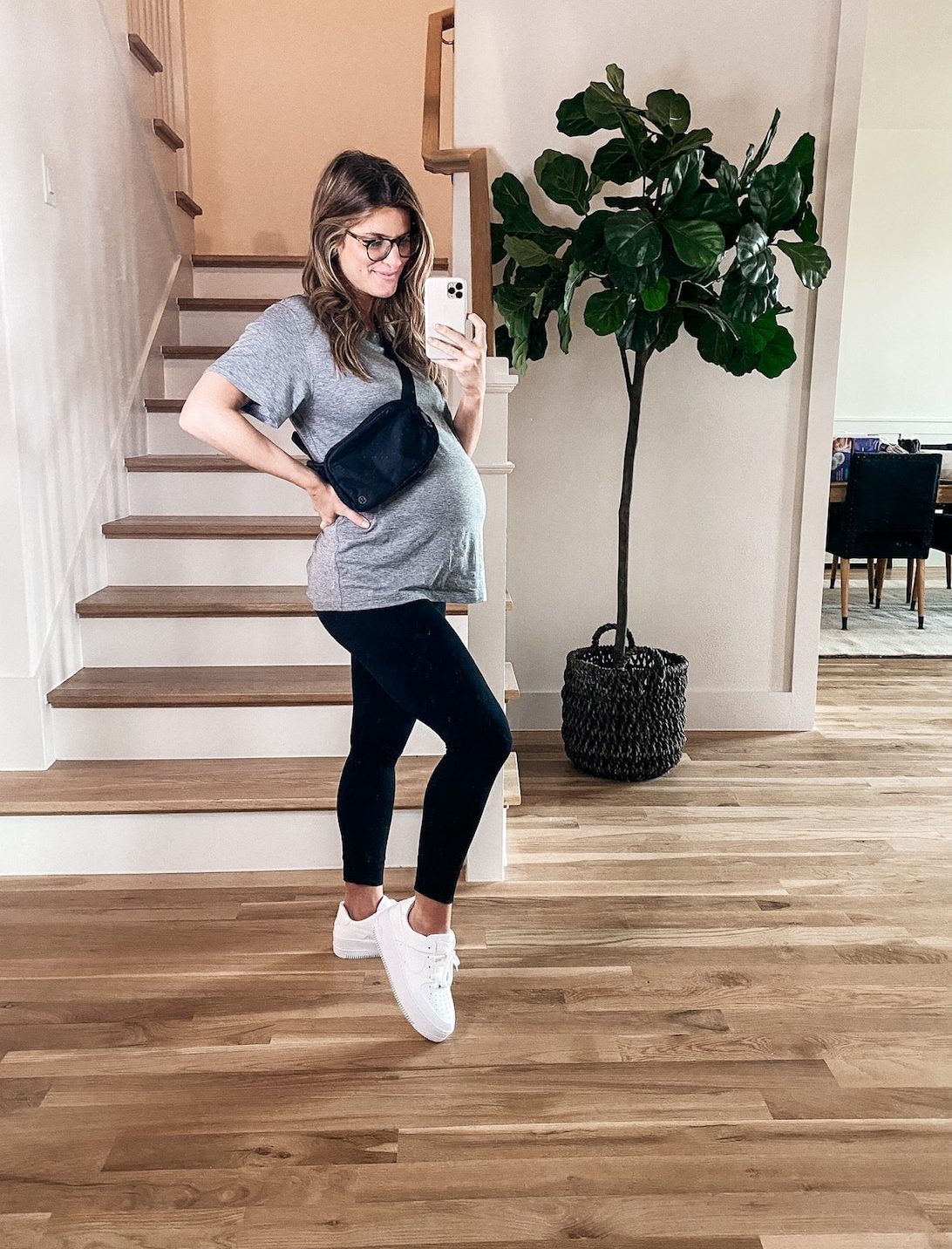 Brighton Butler wearing lulu lemon t-shirt with maternity leggings and Air Force 1's