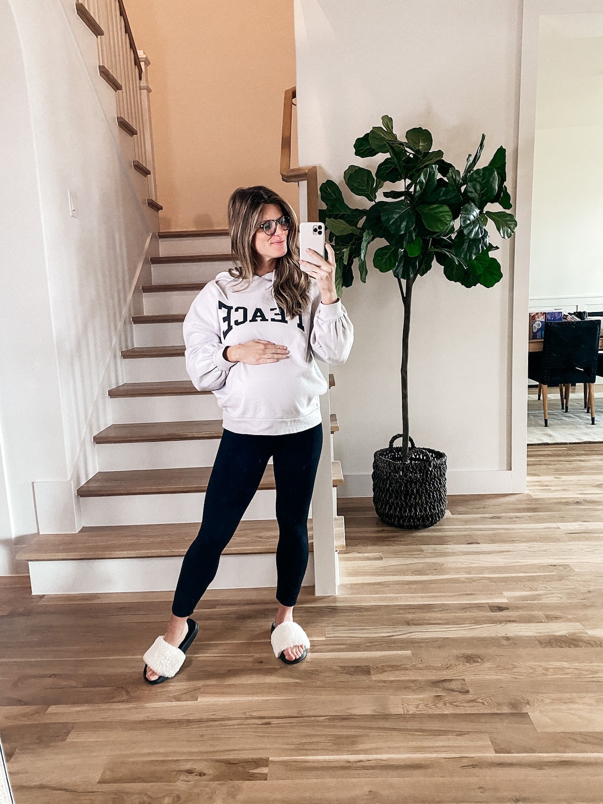 Brighton Butler wearing Topshop peace sweatshirt with maternity leggings and slippers