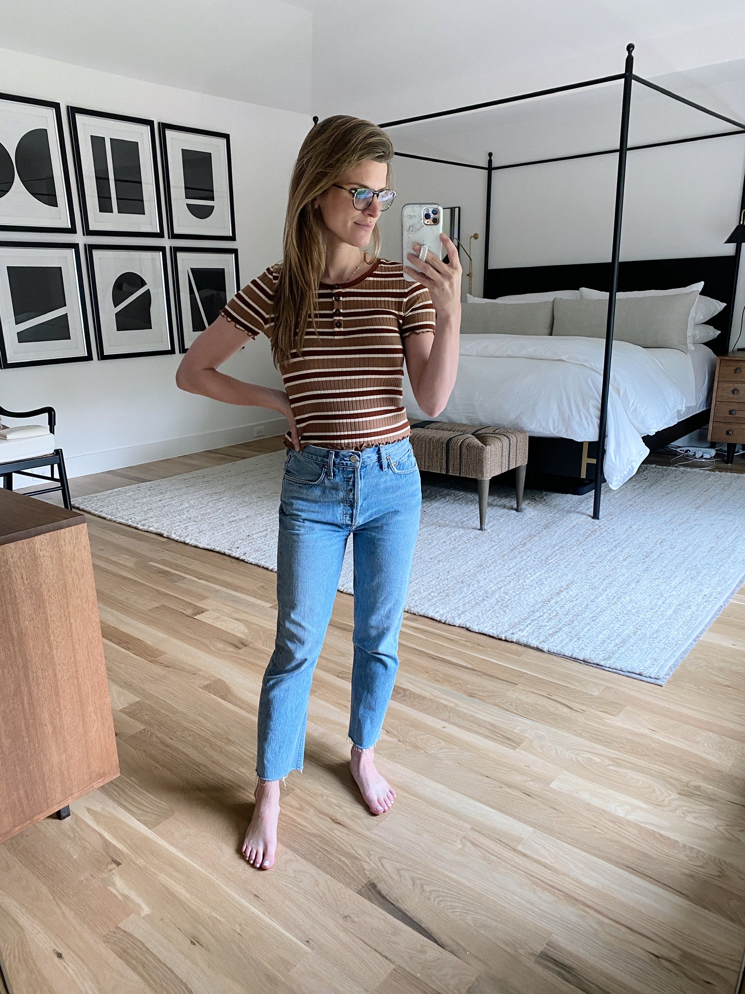 Brighton Butler in striped t-shirt and jeans