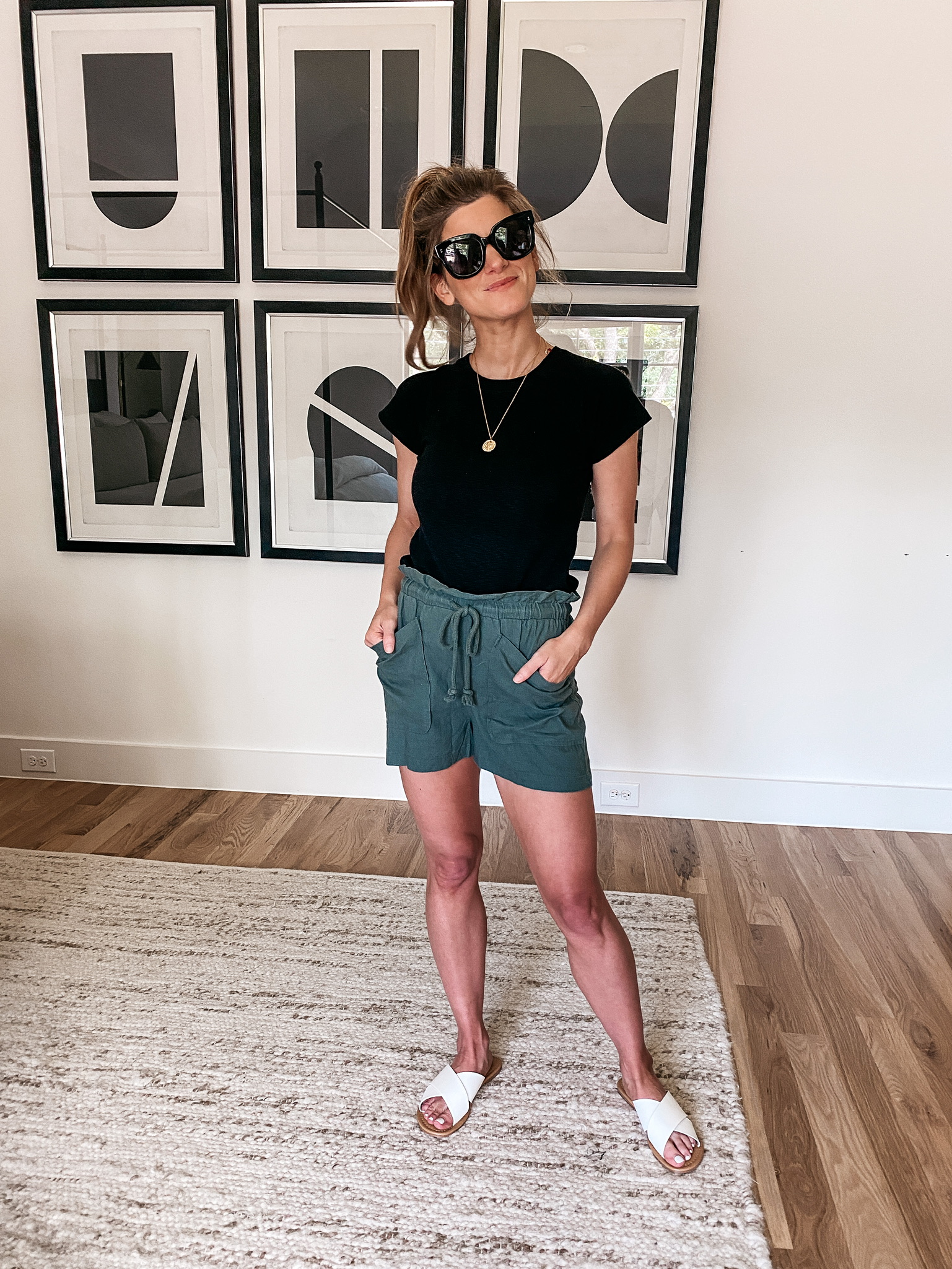 Brighton Butler wearing green shorts and black tee from madewell