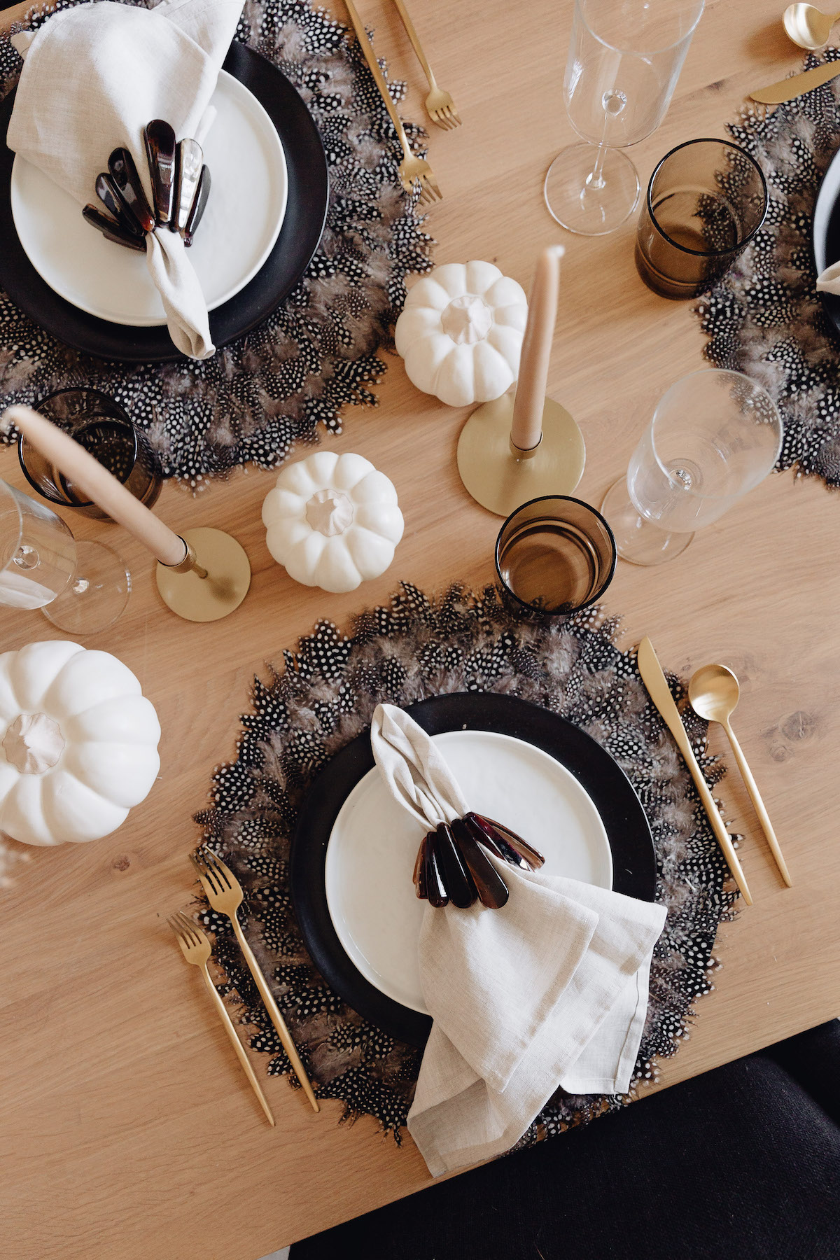 Brighton Butler Fall Tablescape with black and white plates and feather chargers