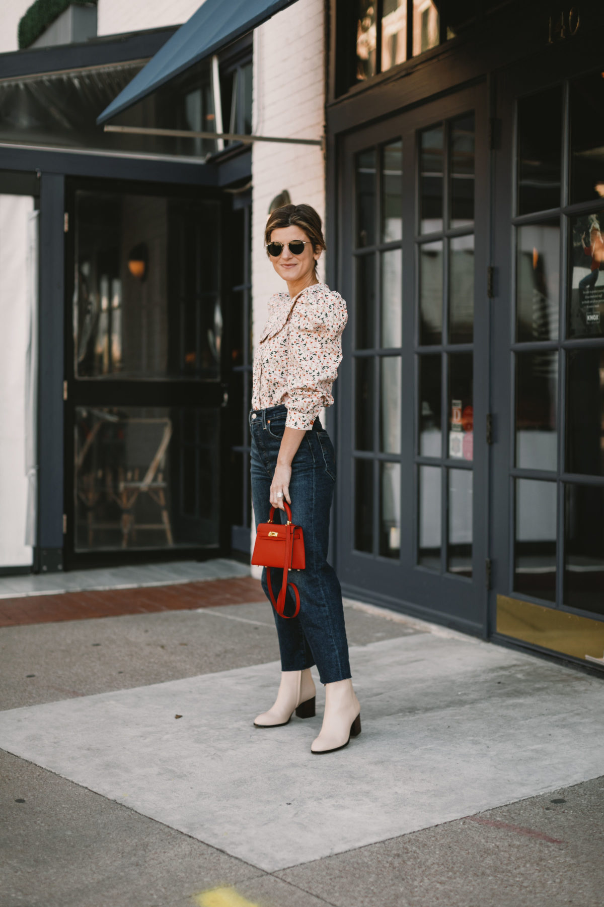Bright Butler wearing CeliaB floral shirt and J.Crew booties