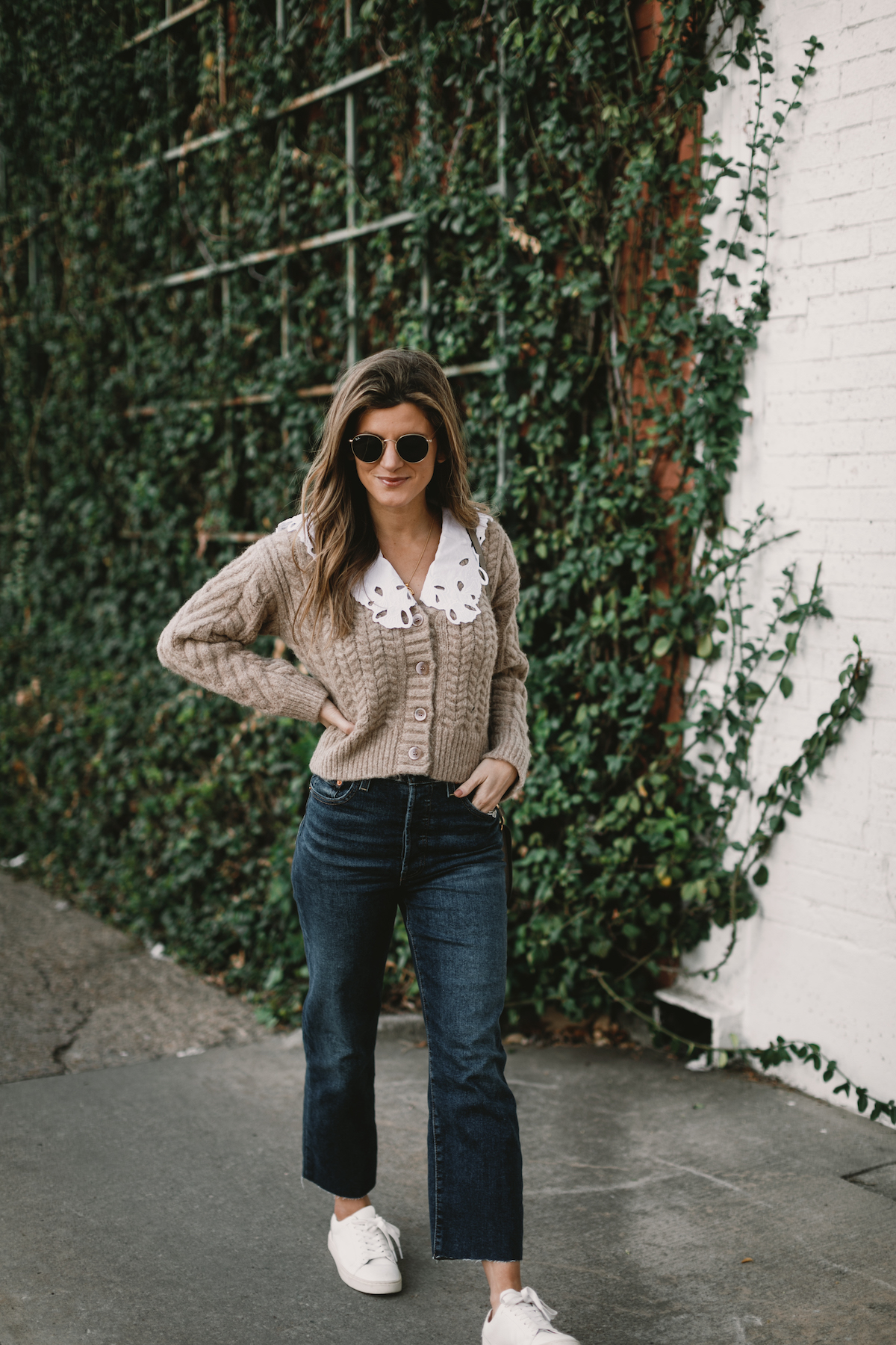 Brighton Butler wearing Levi Ribacage jeans, ASTR Cardigan with white collar and frye sneakers