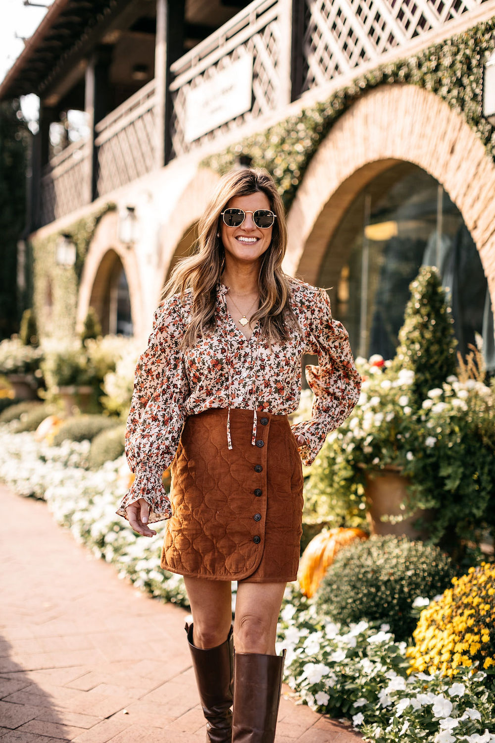 fall outfit burnt orange skirt floral top knee high boots