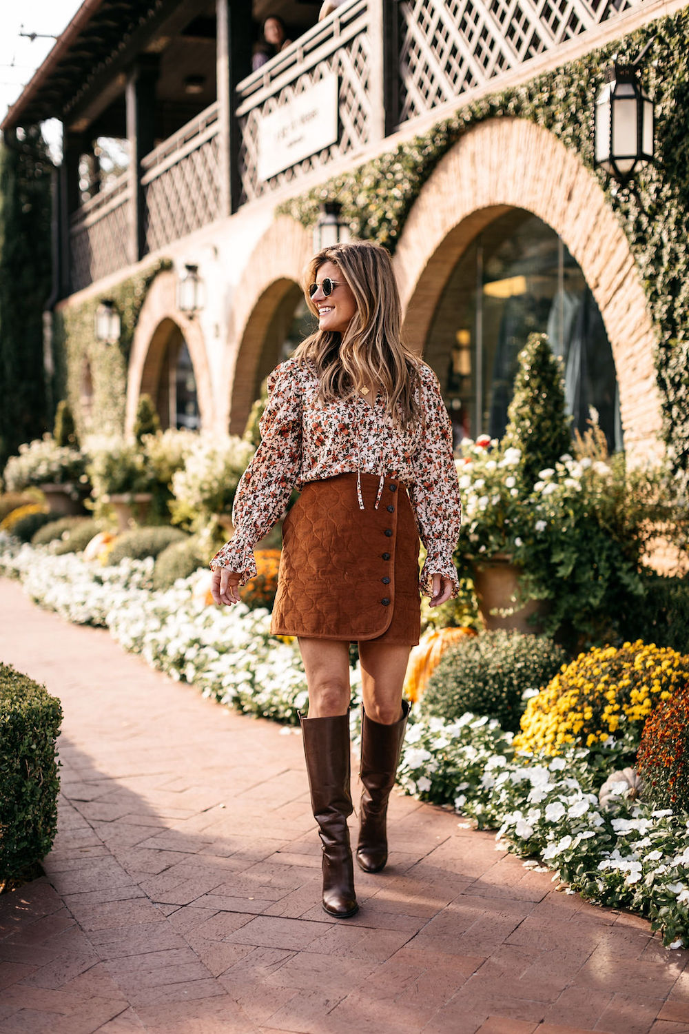 fall outfit burnt orange skirt floral top knee high boots