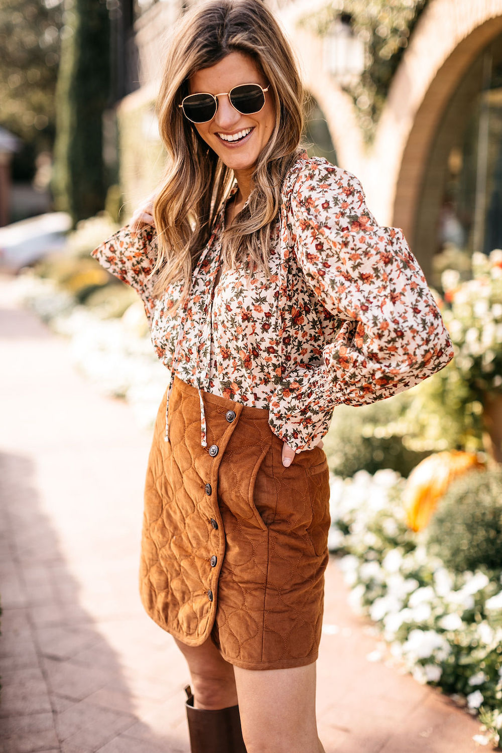 fall outfit burnt orange skirt floral top knee high boots 2