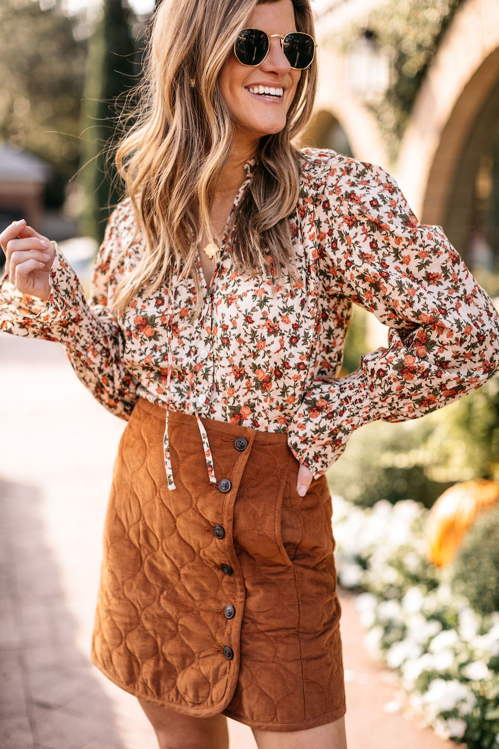 fall outfit burnt orange skirt floral top knee high boots 2