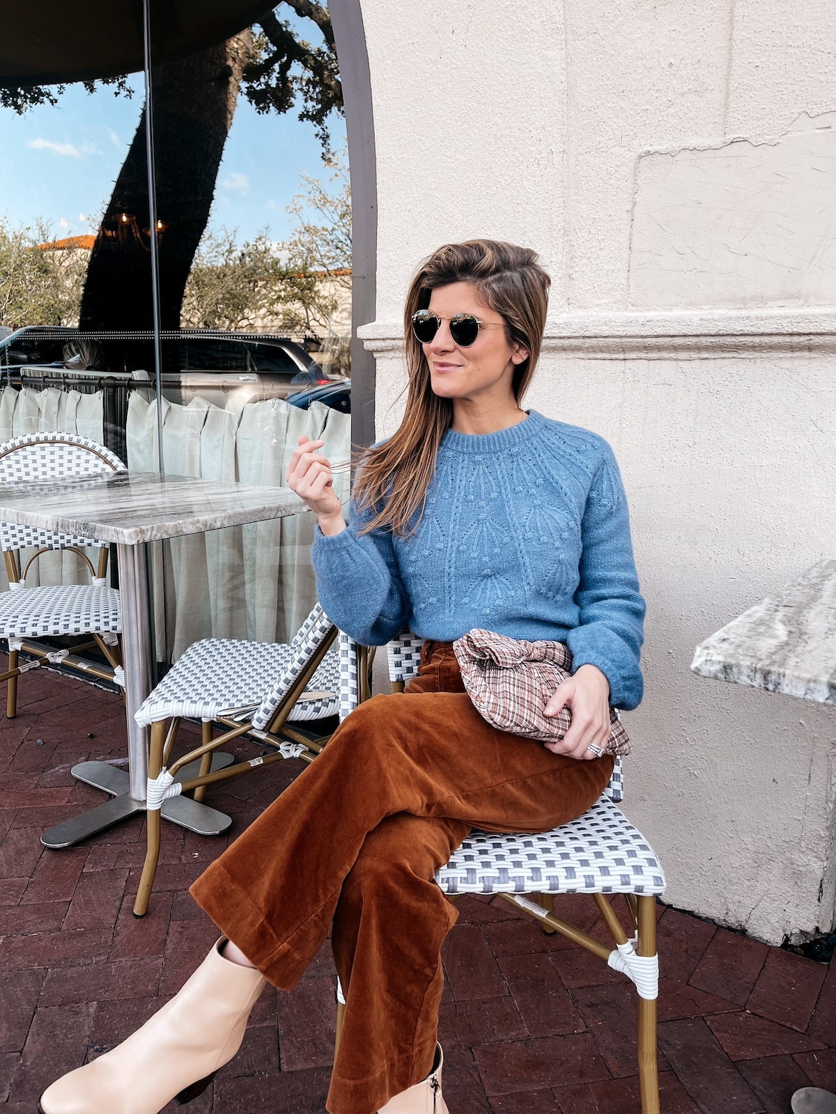 Brighton Butler wearing Boden corduroy pants with blue sweater