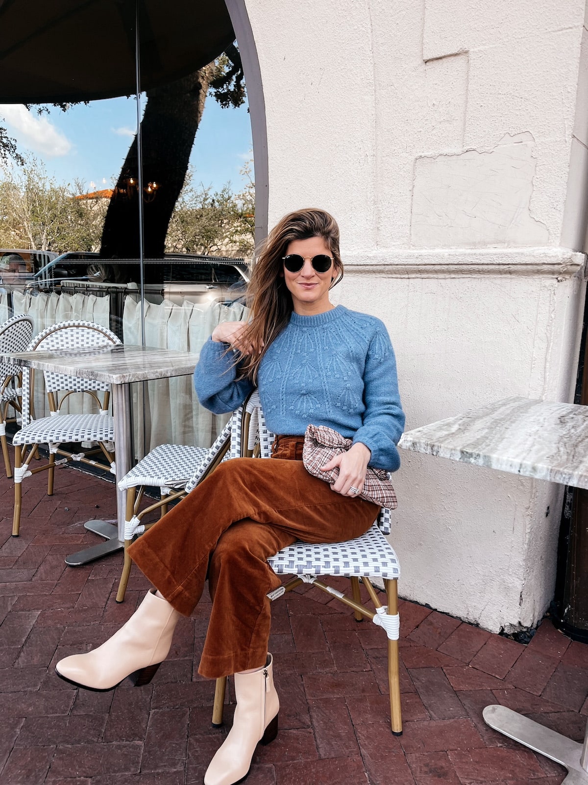 Brighton Butler wearing Boden corduroy pants with blue sweater